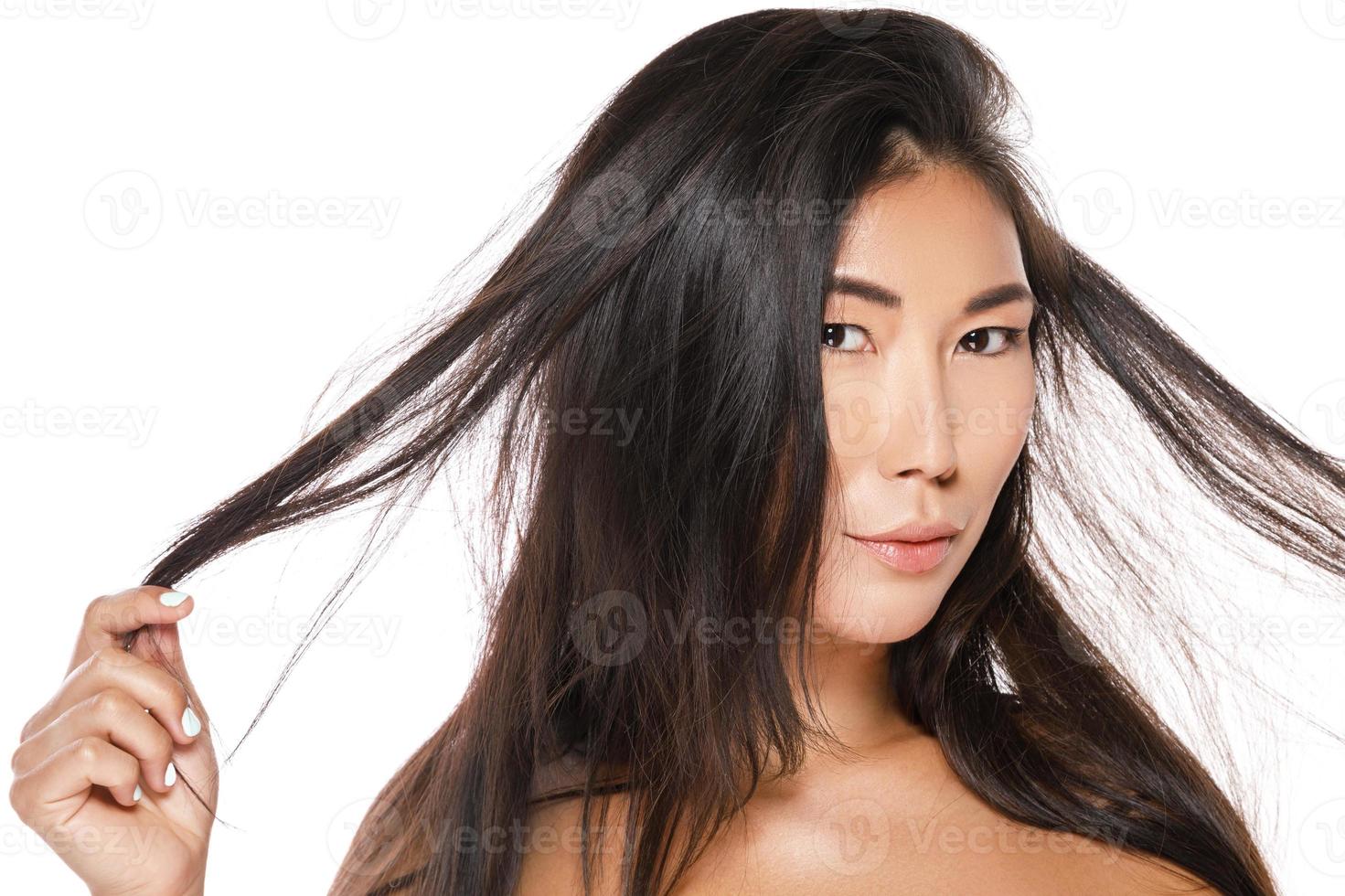 Asian woman with a healthy black hair 14398190 Stock Photo at Vecteezy