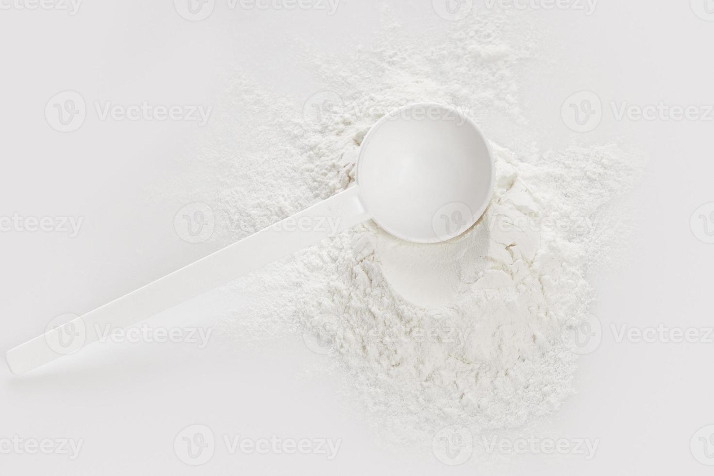 Scoop with creatine monohydrate supplement photo