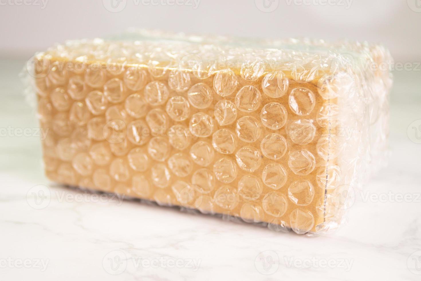 Bubbles covering the box by bubble wrap for protection product photo