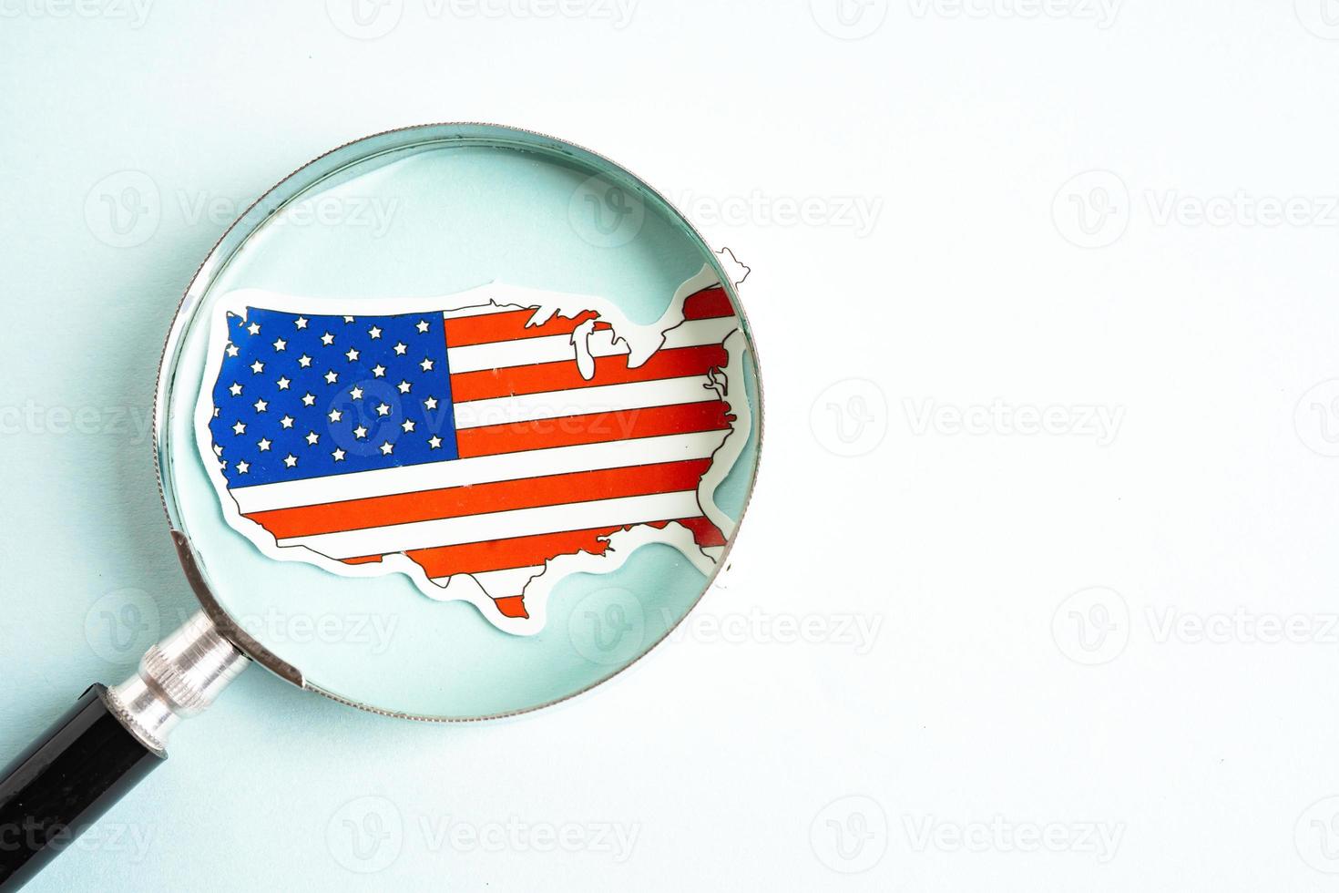 USA America flag and magnifying glass with copy space. photo