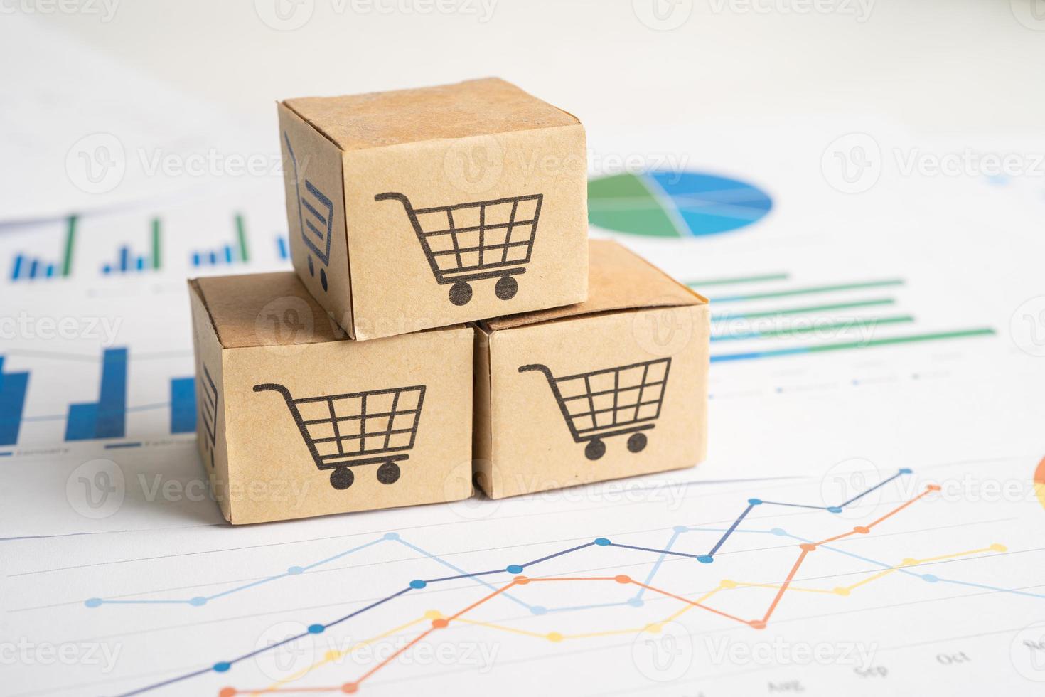 Shopping cart logo on box on graph background. Banking Account, Investment Analytic research data economy, trading, Business import export transportation online company concept. photo