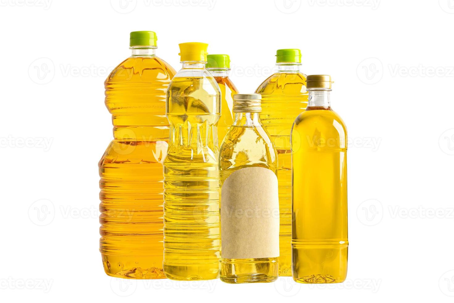 Vegetable oil with olive oil in different bottle for cooking isolated on white background. photo