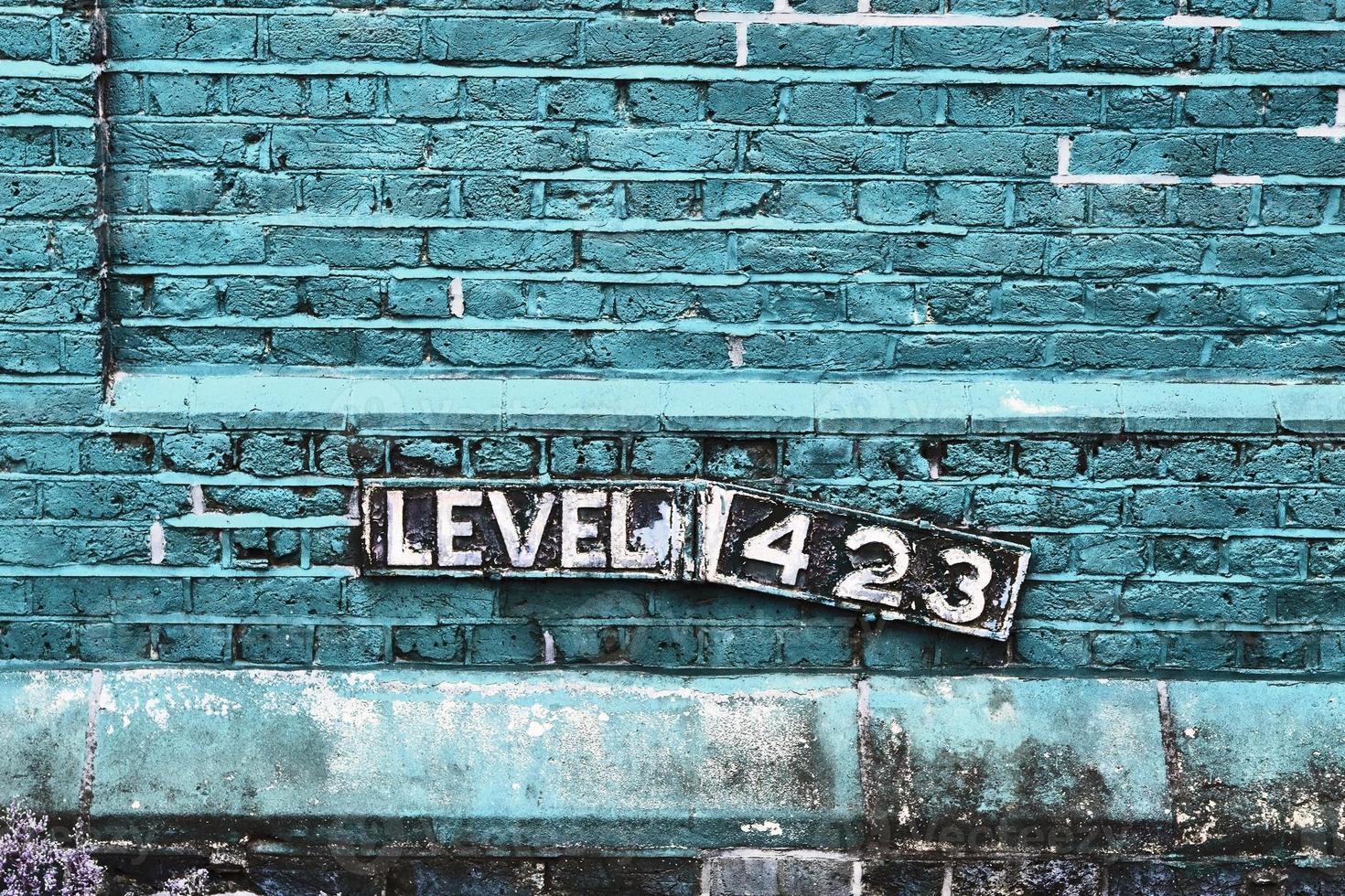 Detailed view at a colorful old and weathered brick wall texture as a panoramic background. photo