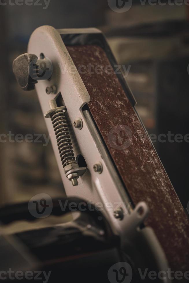 Polishing machine with a sandpaper in workshop photo