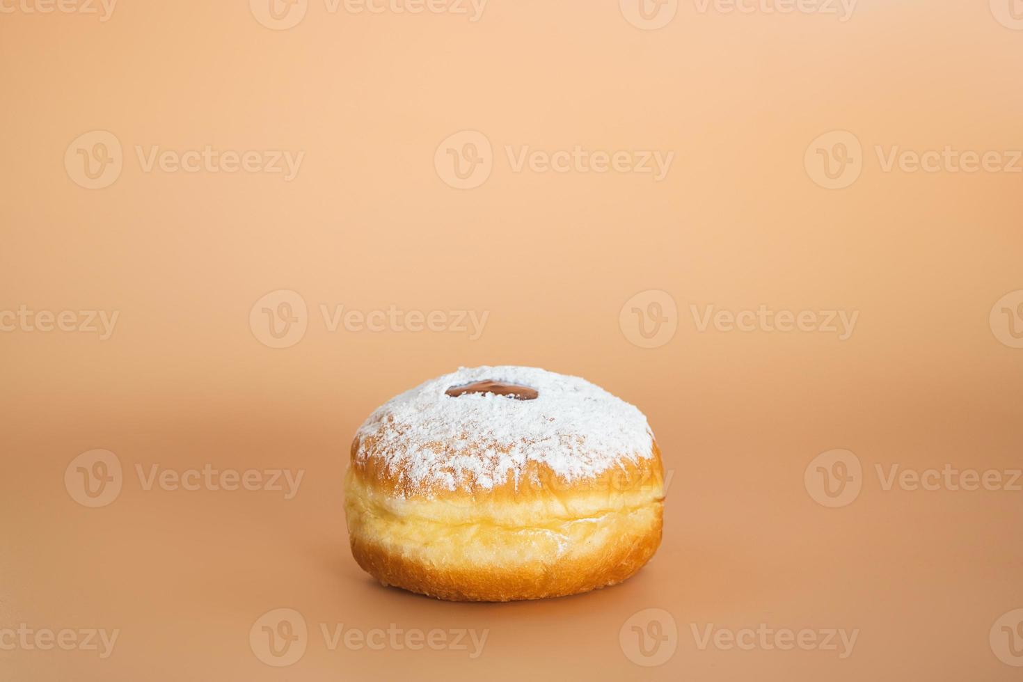 Happy Hanukkah. Traditional Jewish dessert Sufganiyot. Celebrating Judaism holiday. Donuts with jam and sugar powder. photo