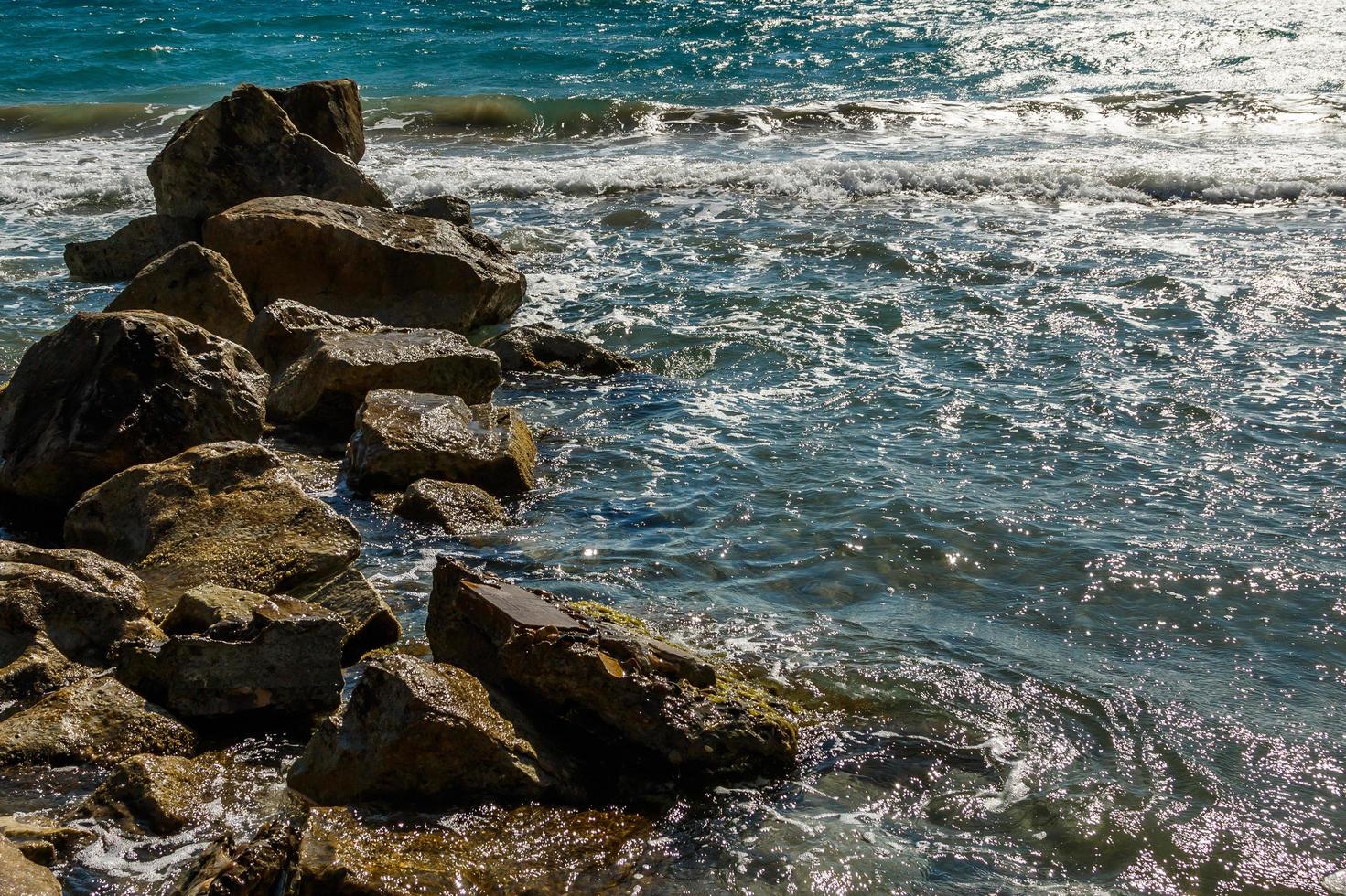 Beautiful sea view with blue water and rocks photo