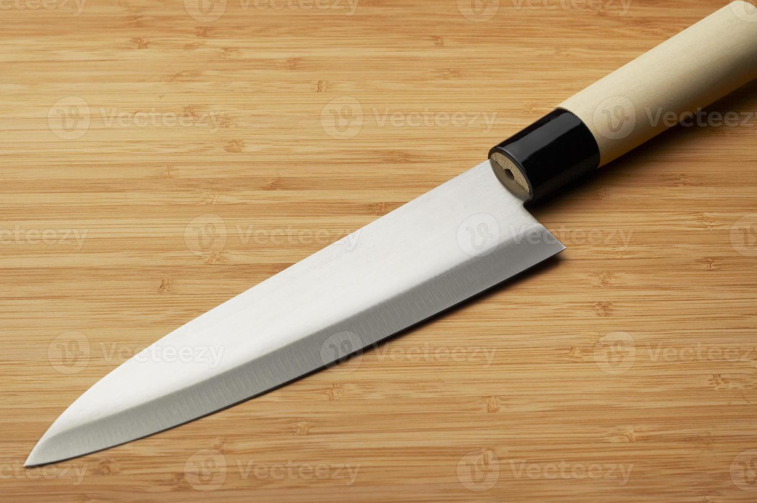 Knife on a bamboo background photo