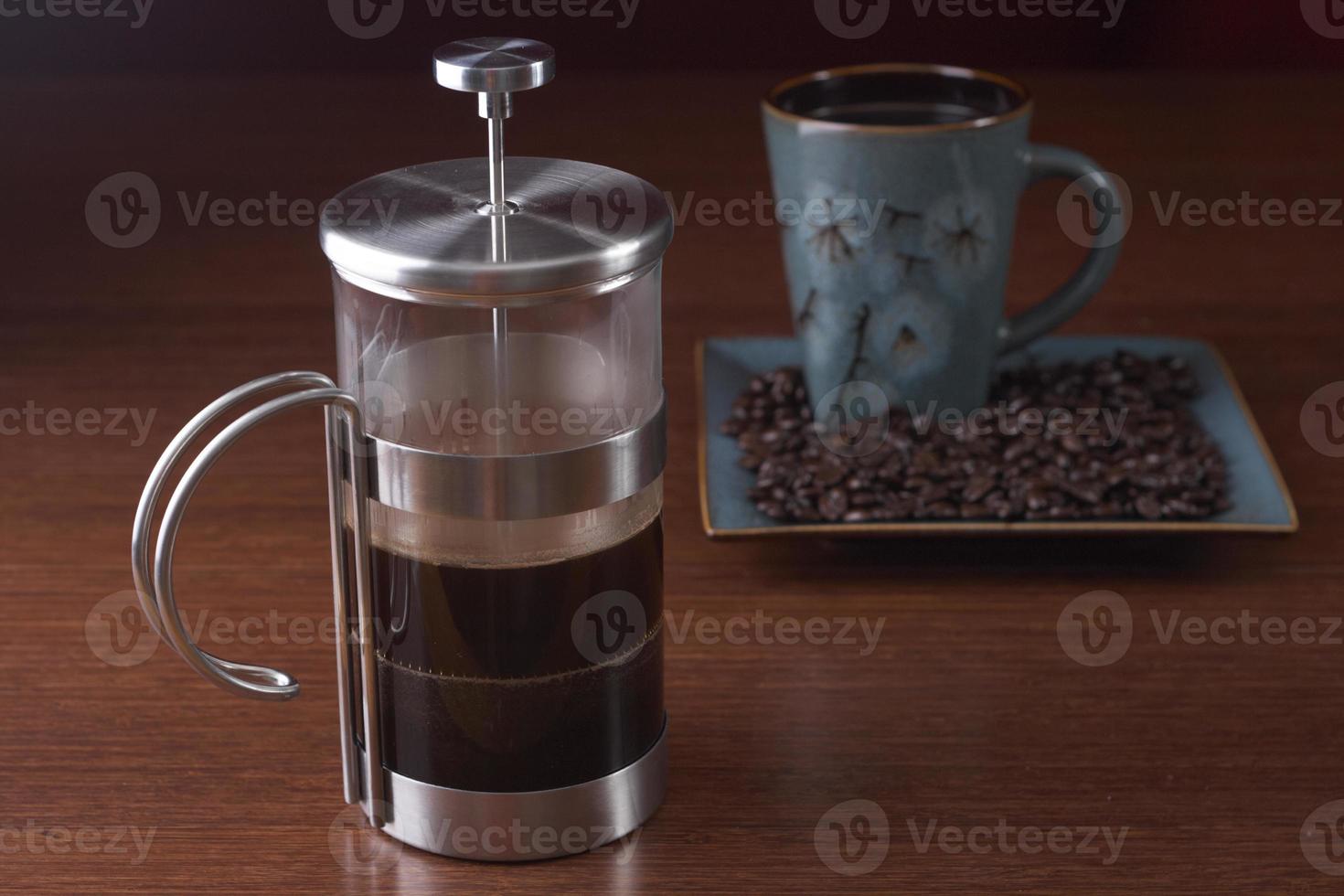 French press and a coffee cup photo