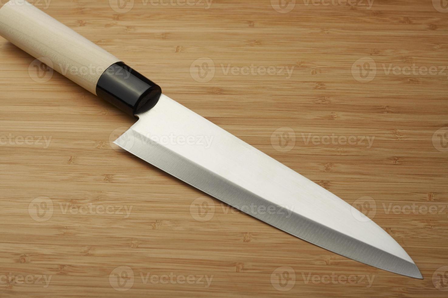 Knife on a bamboo background photo