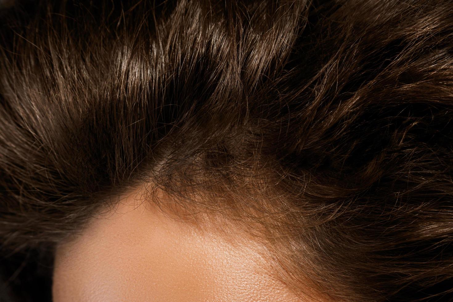 Close up of female healthy hair details photo