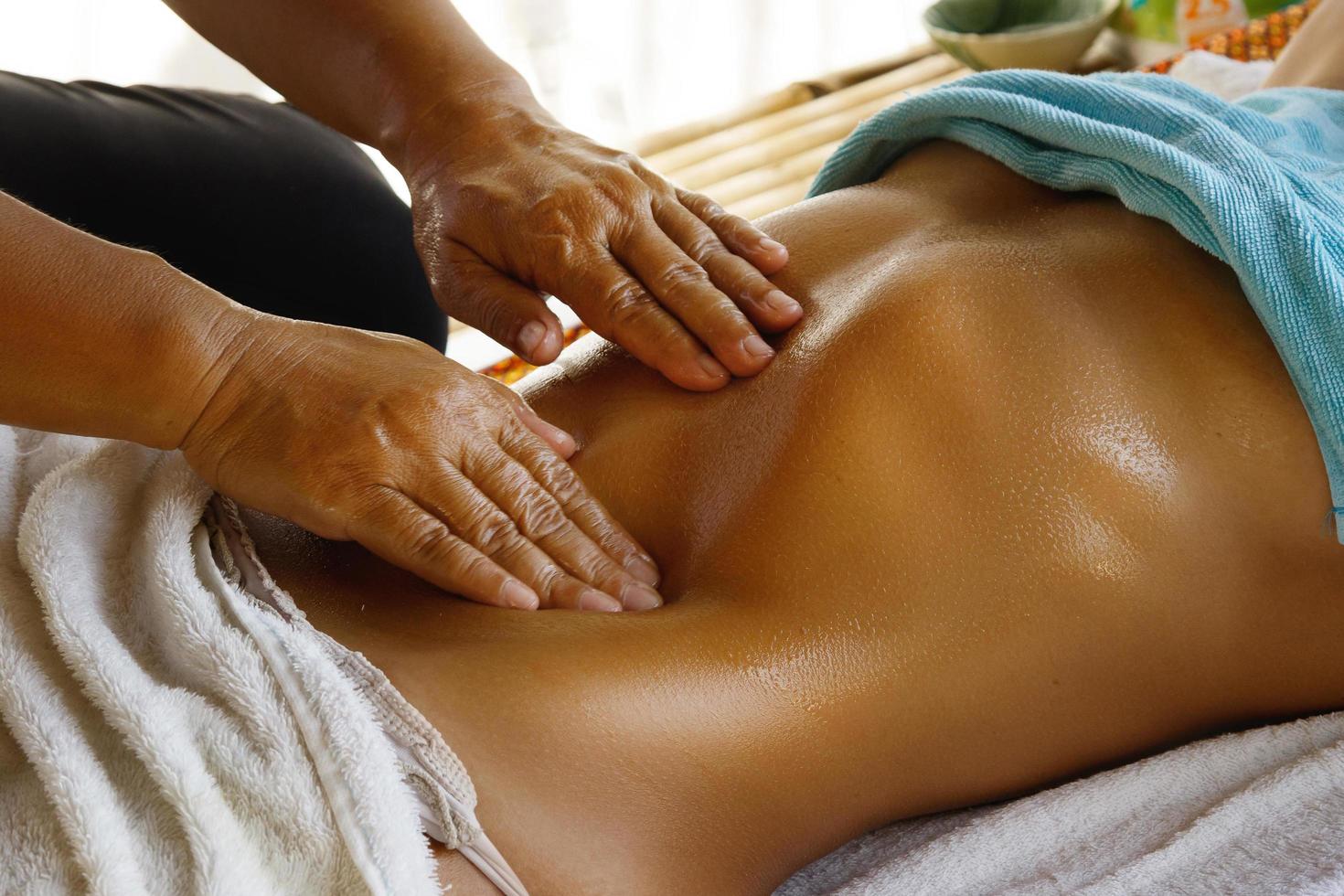 Closeup of Female belly during professional massage photo