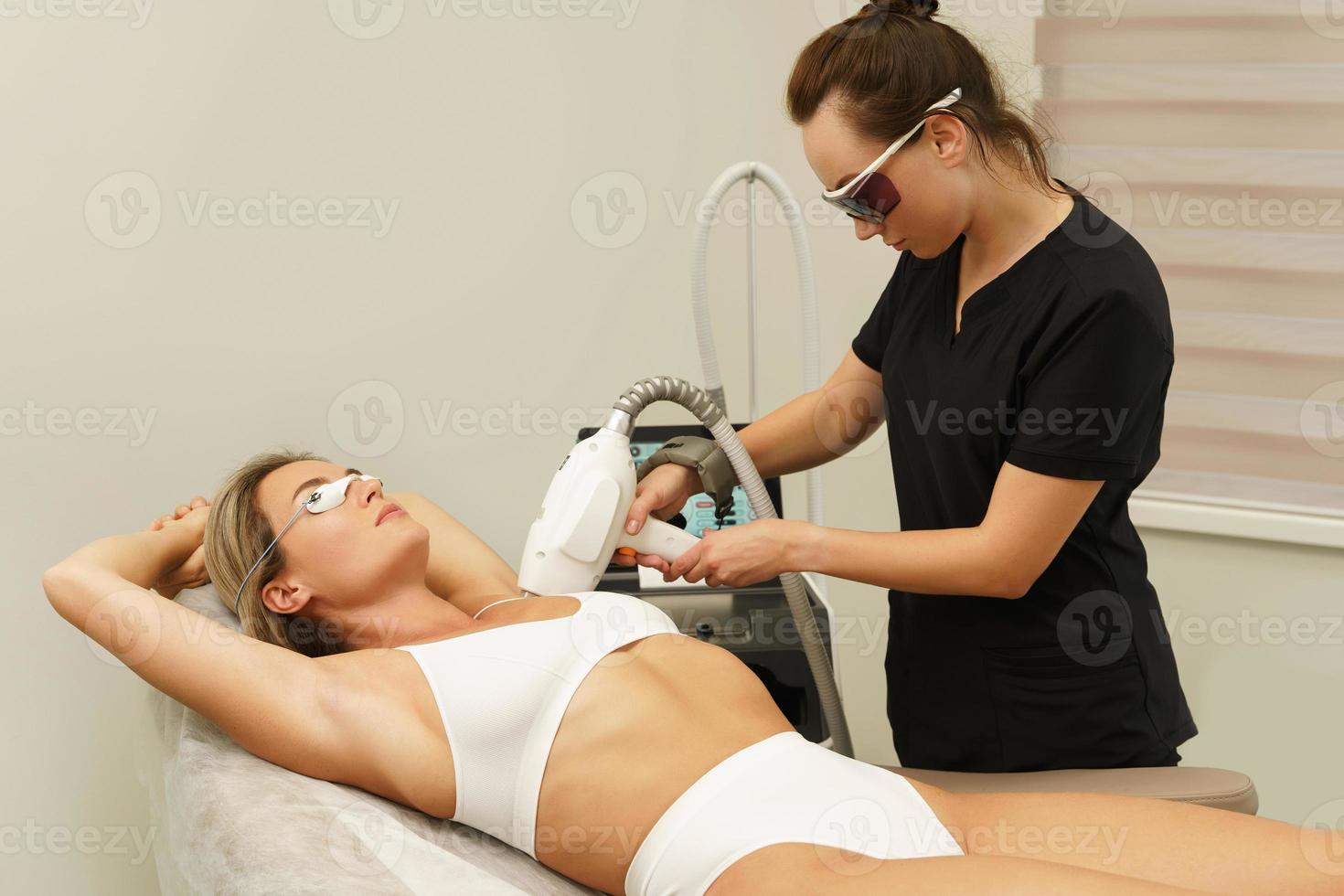 IPL photoepilation procedure in aesthetic medical clinic photo