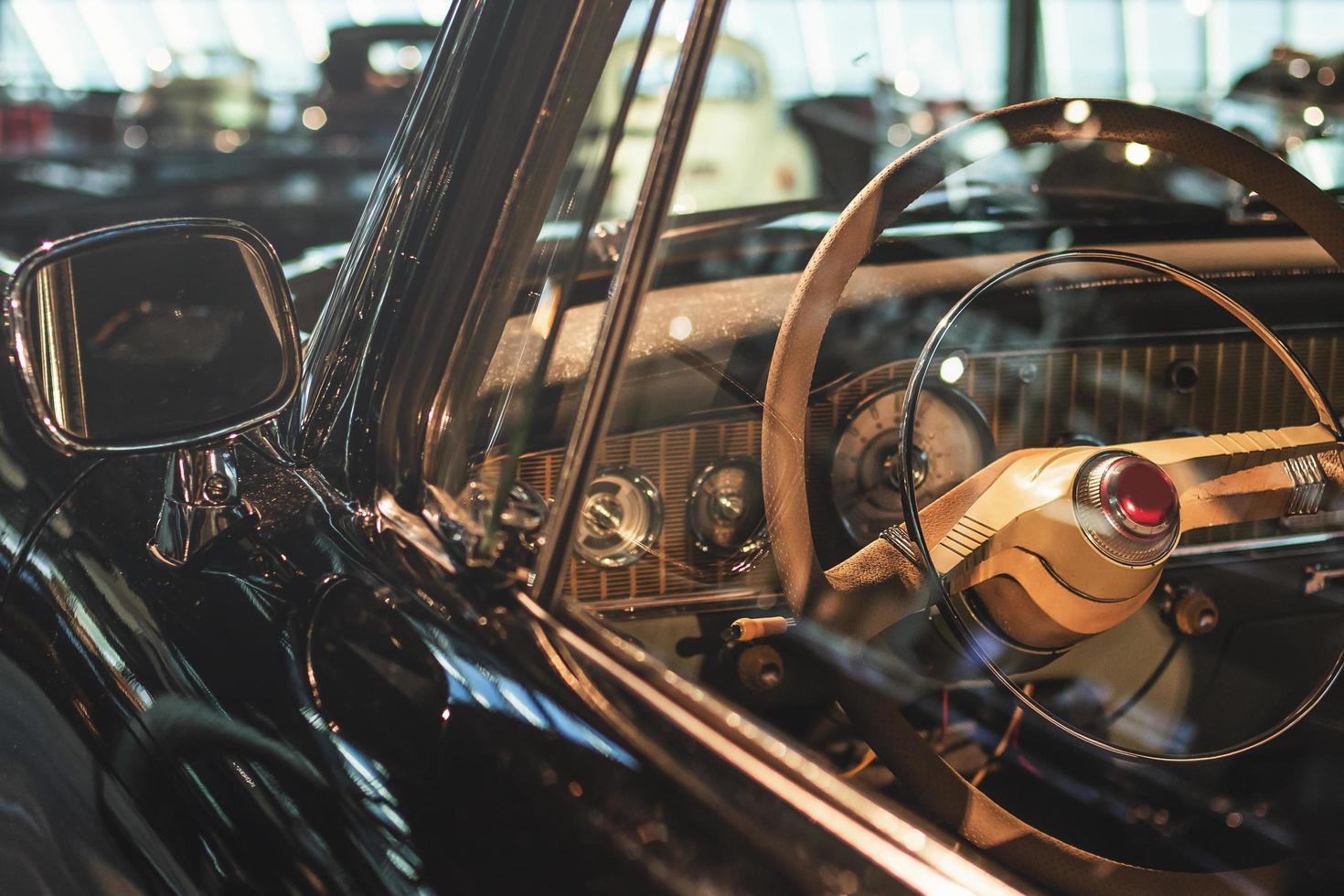 Steering wheel and part of interior of the retro photo