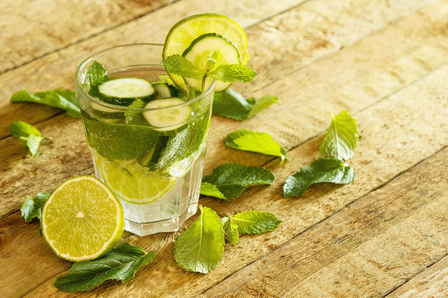 Refreshing drink with cucumber, lime and mint photo