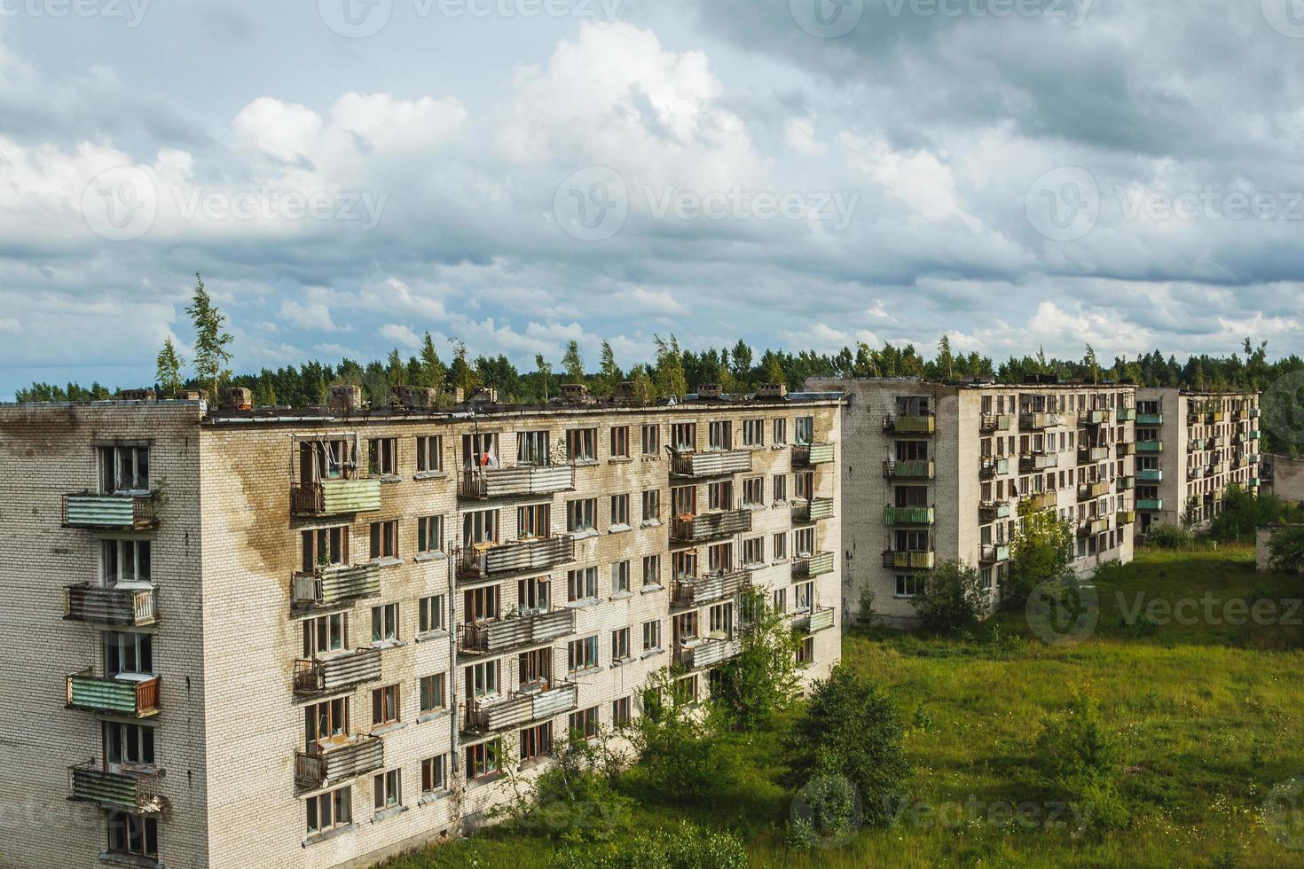 Exterior of abandoned apartment buildings in european ghost town. photo