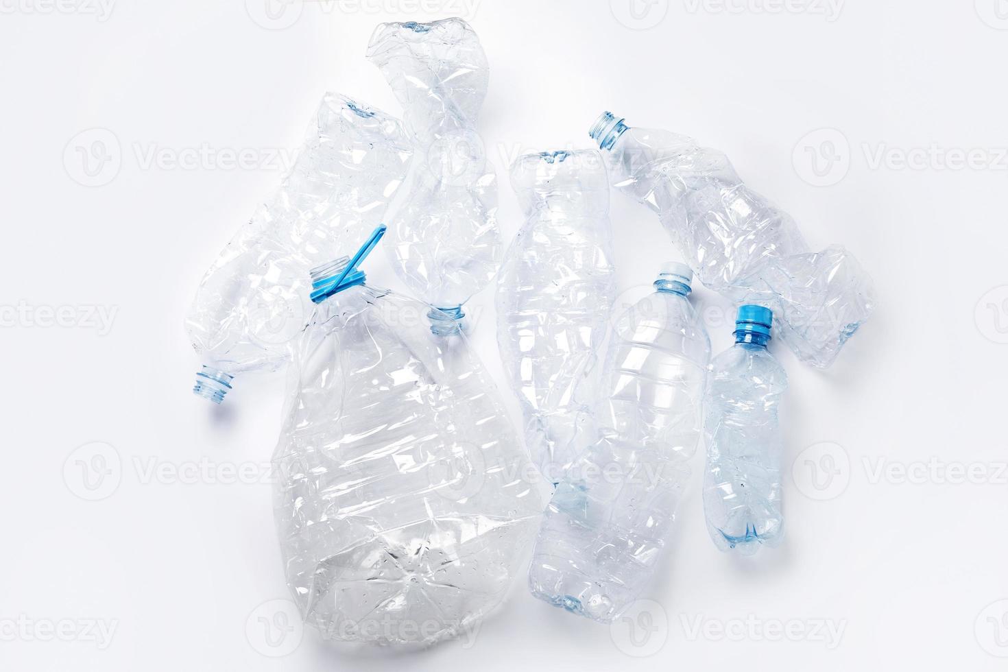 Concepts of pollution and recycling. Different used plastic bottles photo