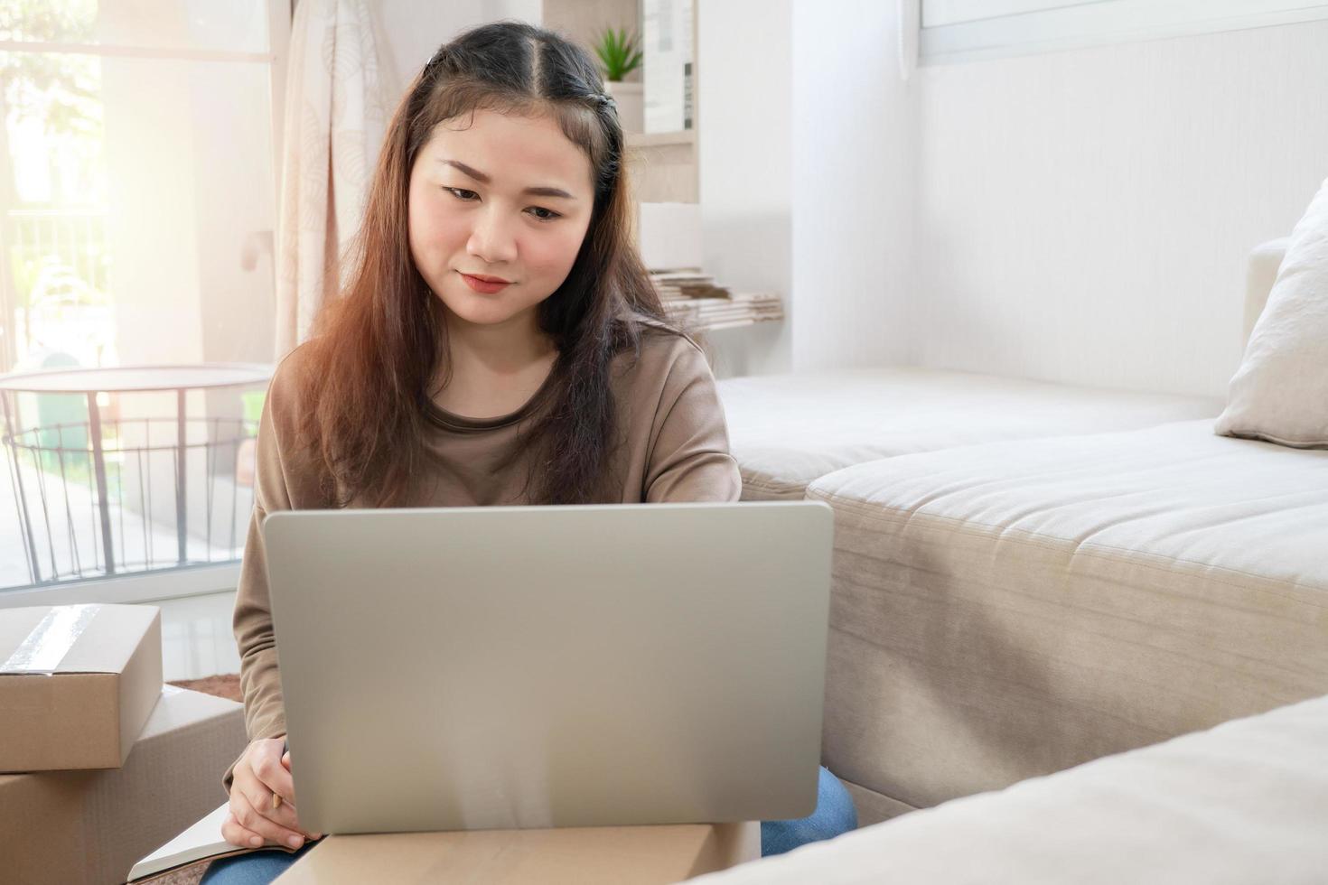 Unhappy Asian young entrepreneur, Tired expression And fed up with problems in doing business at home office, Concept of merchant business online and eCommerce photo