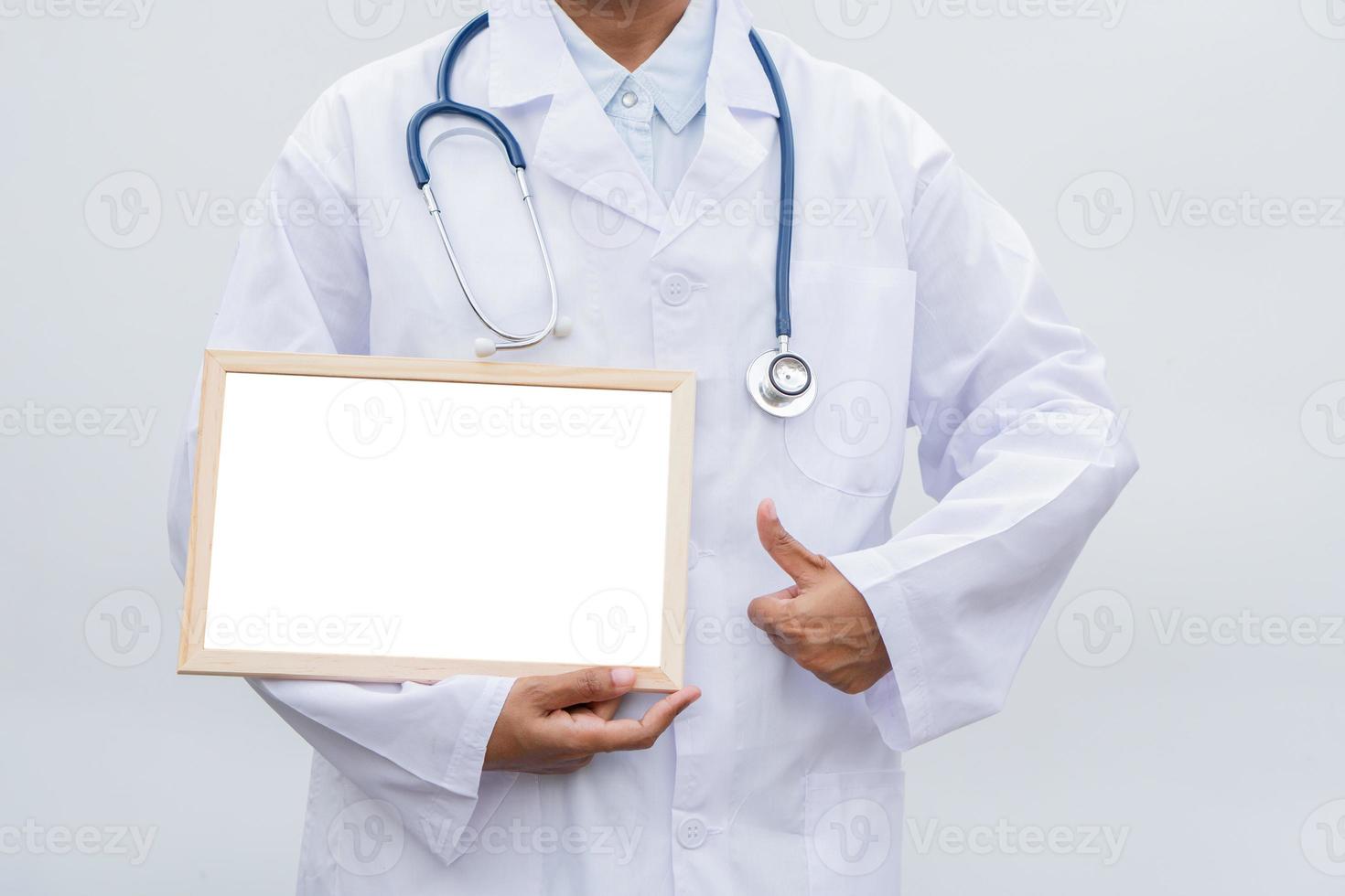 profession doctor in white coat over white isolated background with white blank board and Thumbs up. Concept of healthcare, science and medicine concept photo