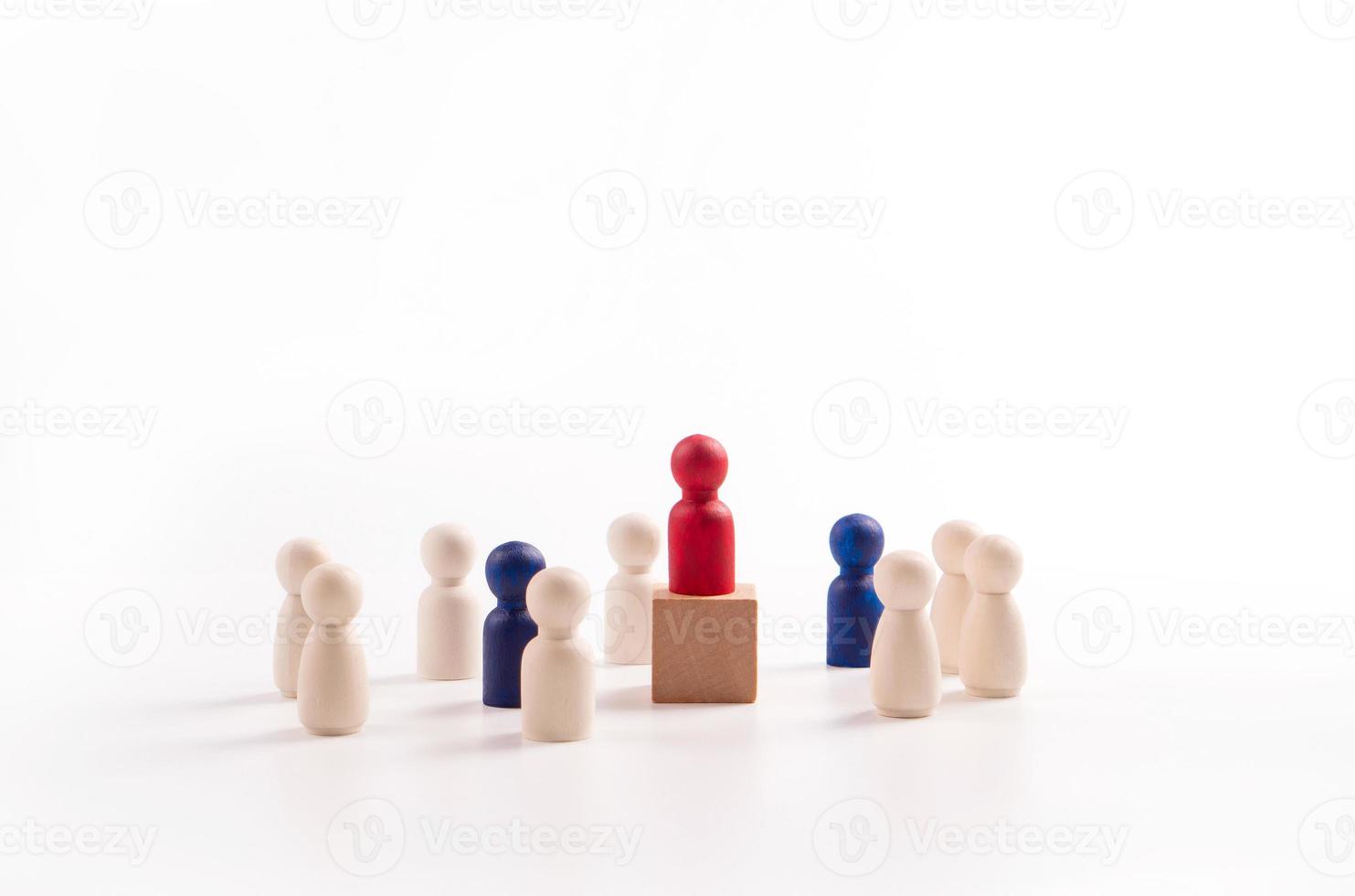Wooden figure standing on the box for show influence and empowerment. Concept of business leadership for leader team, successful competition winner and Leader with influence photo