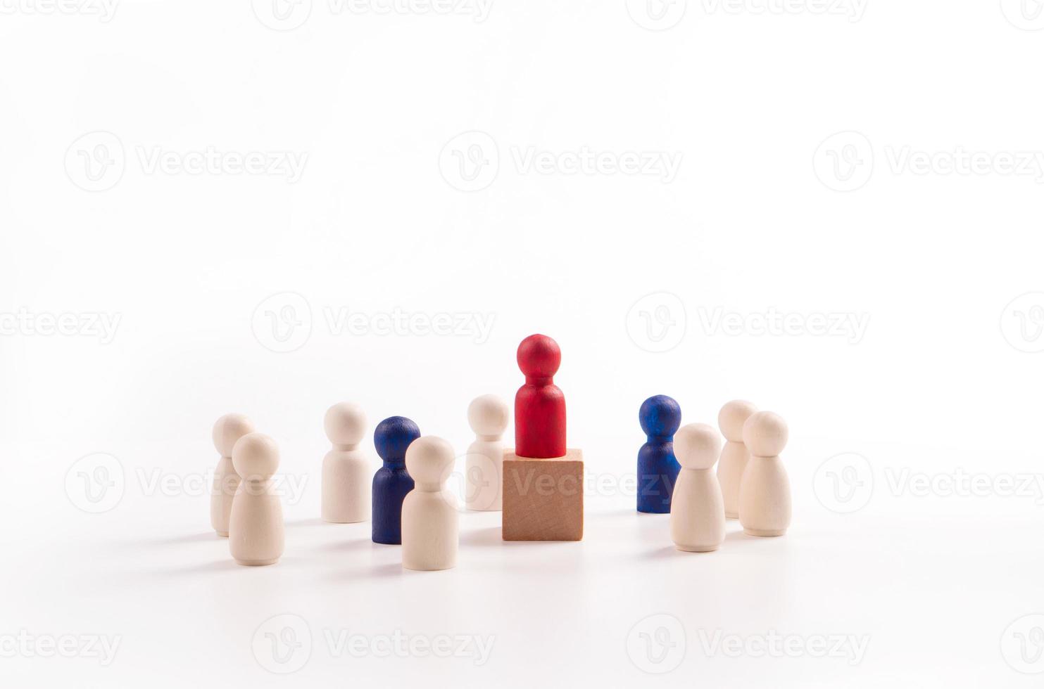 Wooden figure standing on the box for show influence and empowerment. Concept of business leadership for leader team, successful competition winner and Leader with influence photo