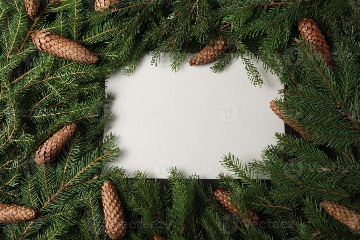 New Year's Eve background with fir branch and cones. Christmas and New Year holidays composition of pine tree branches. Happy New Year 2023 photo