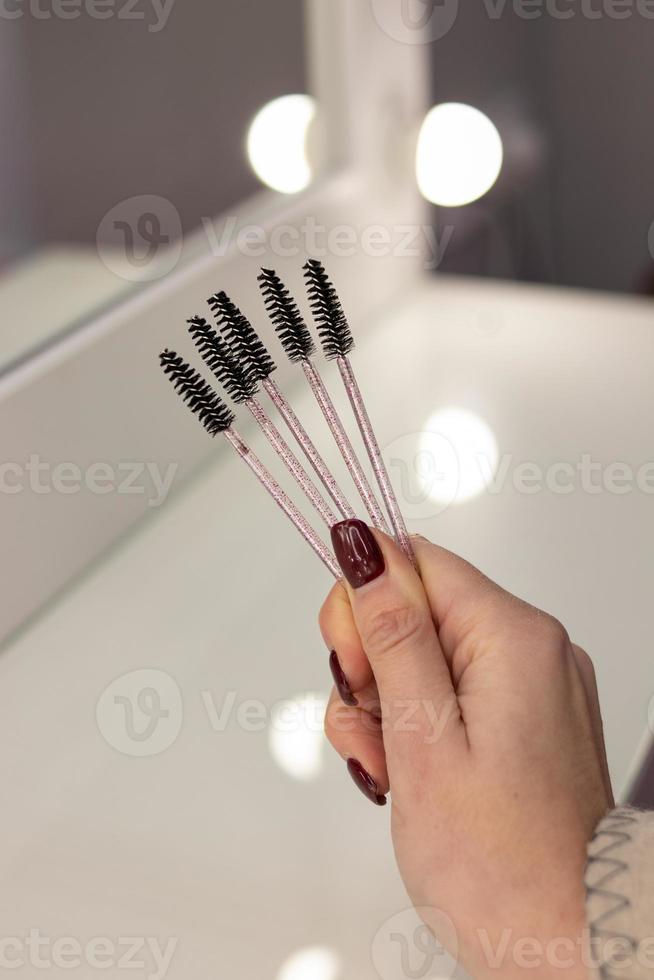 Black brushes for eyebrows and eyelashes. Brush set photo