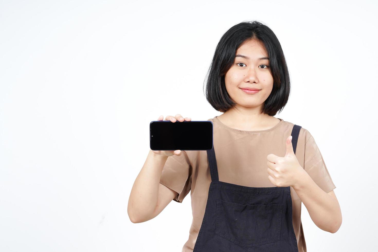 Showing Apps or Ads On Blank Screen Smartphone Of Beautiful Asian Woman Isolated On White Background photo