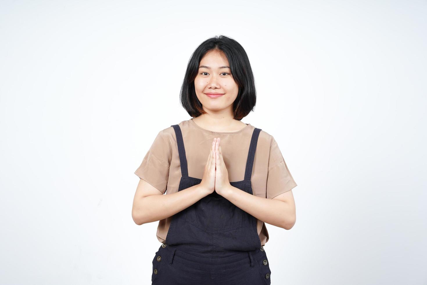 Doing Namaste Greeting Of Beautiful Asian Woman Isolated On White Background photo