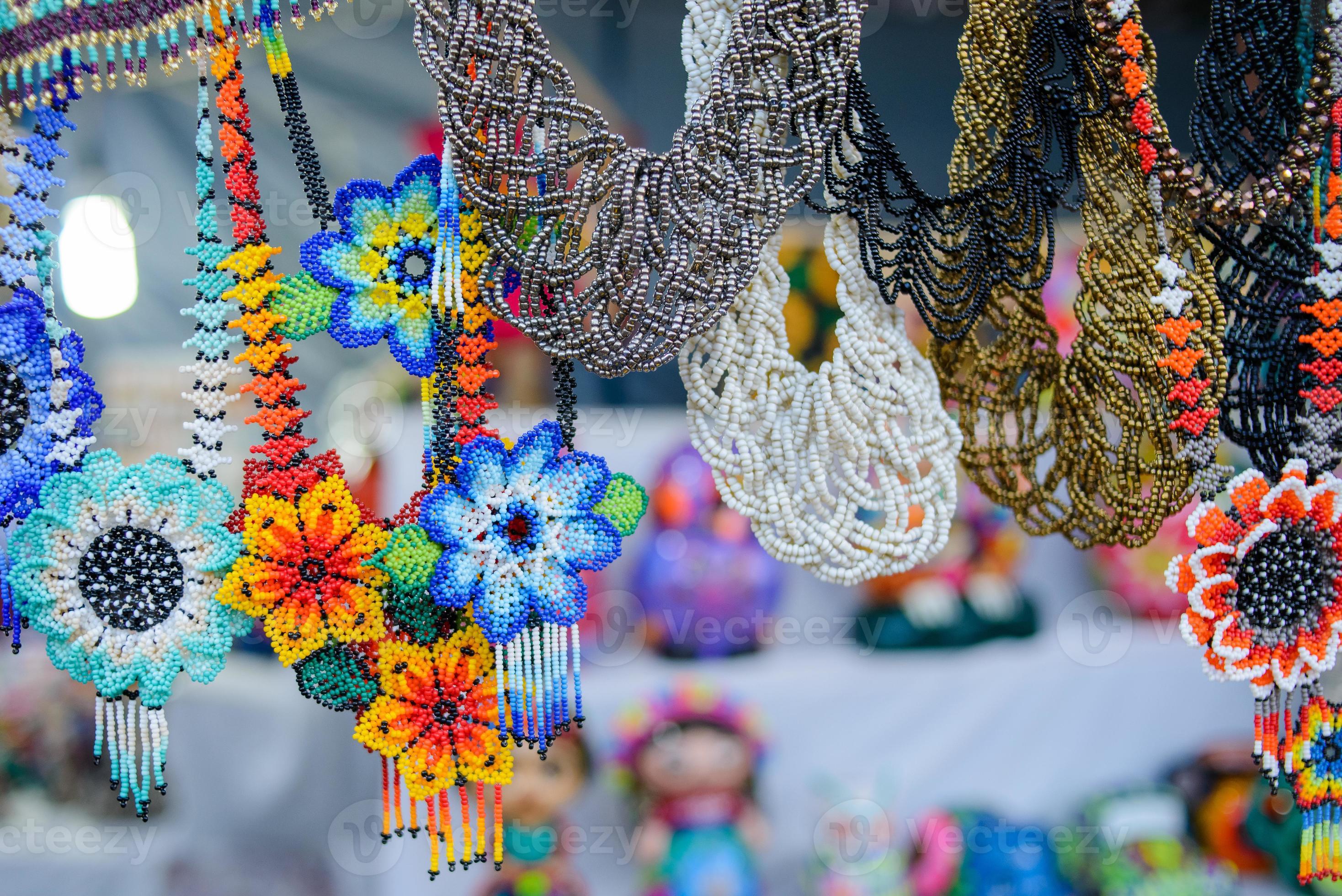 Accessories made with multicolored chaquira. handicrafts made with colorful stones. 14441953 Stock Photo at Vecteezy