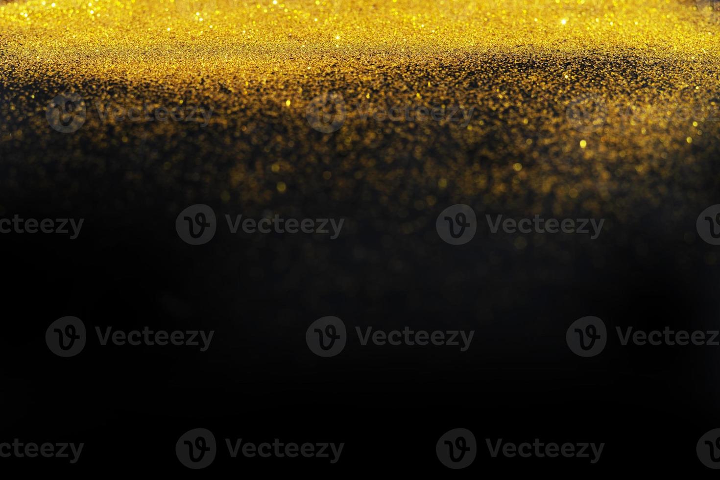 Dark texture with a sprinkling of gold. Backdrop with golden sparkle for overlay photo effect filters. fancy, luxury, themed backgrounds.