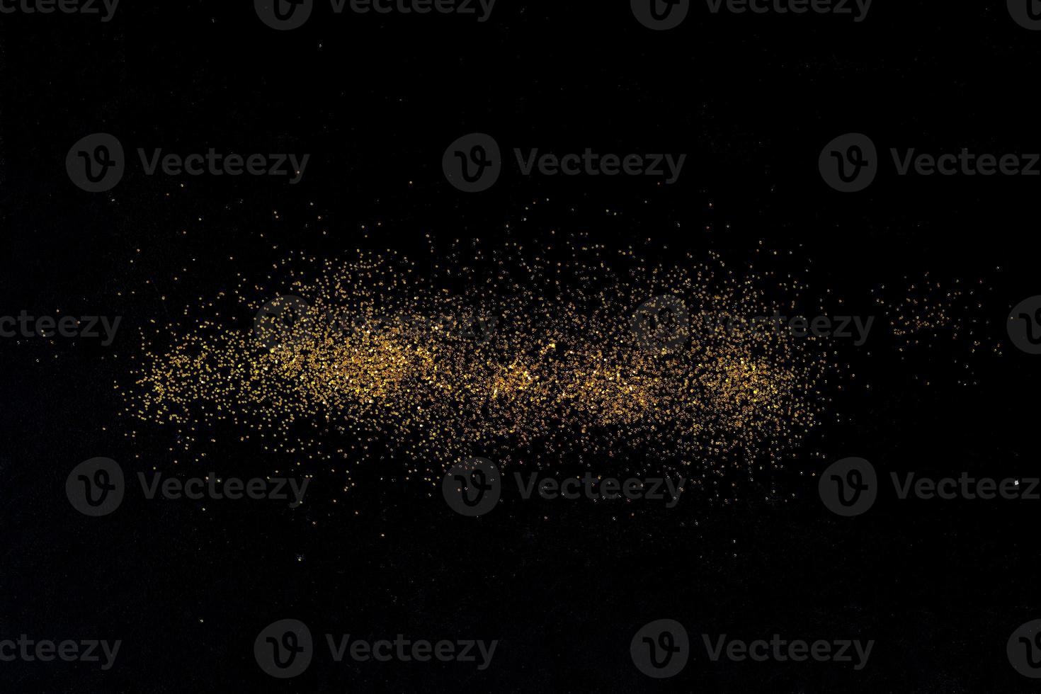 Dark texture with a sprinkling of gold. Backdrop with golden sparkle for overlay photo effect filters. fancy, luxury, themed backgrounds.