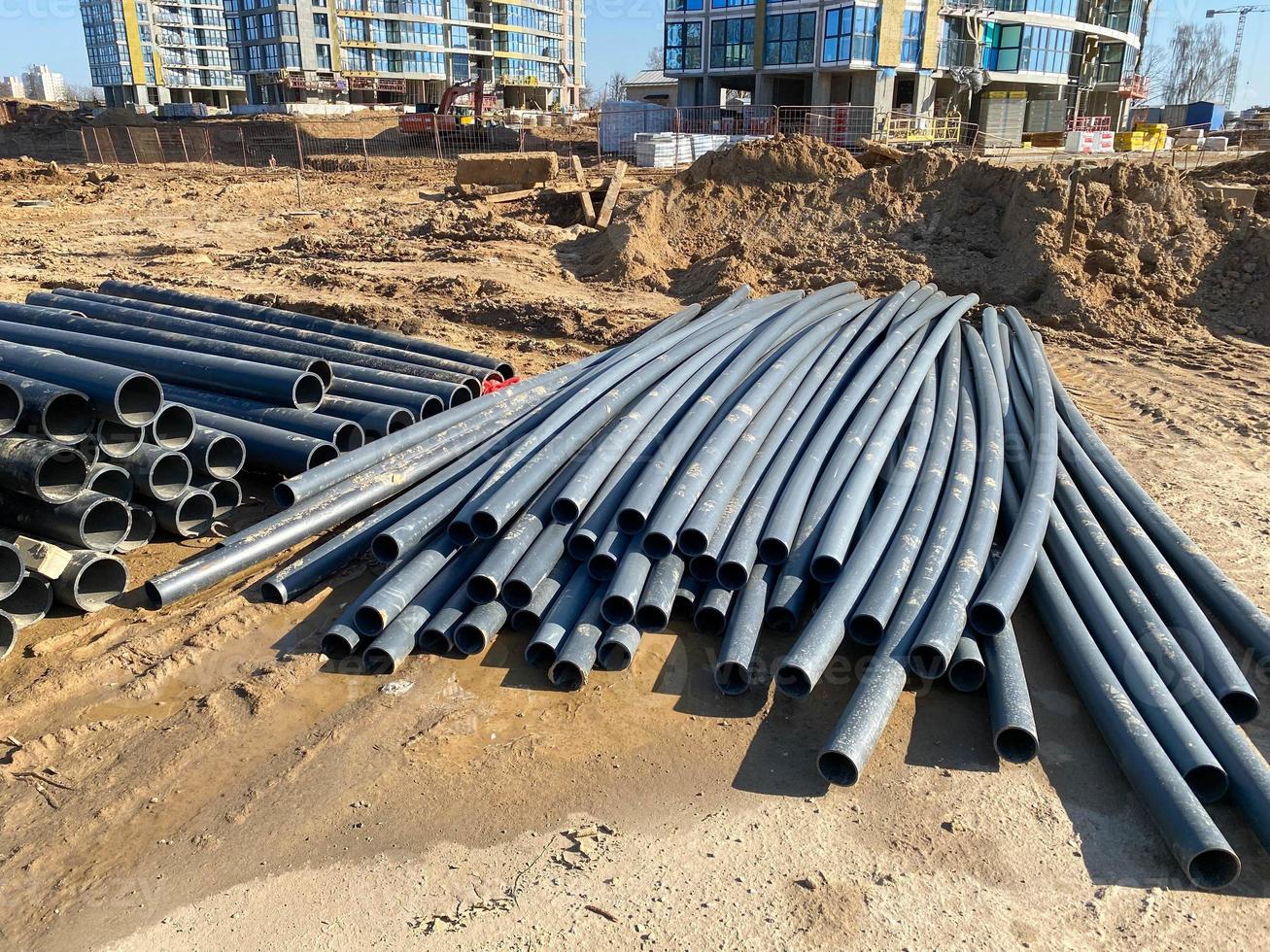 Modern polypropylene pipes for conducting heating mains underground. Durable and anticorrosive properties of water pipes, drainage system photo