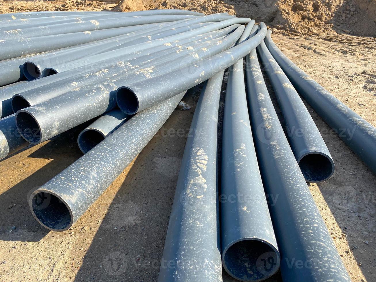 Warehouse of polypropylene pipes. Workshop with extruders for producing plastic pipes. High speed extrusion line of photo
