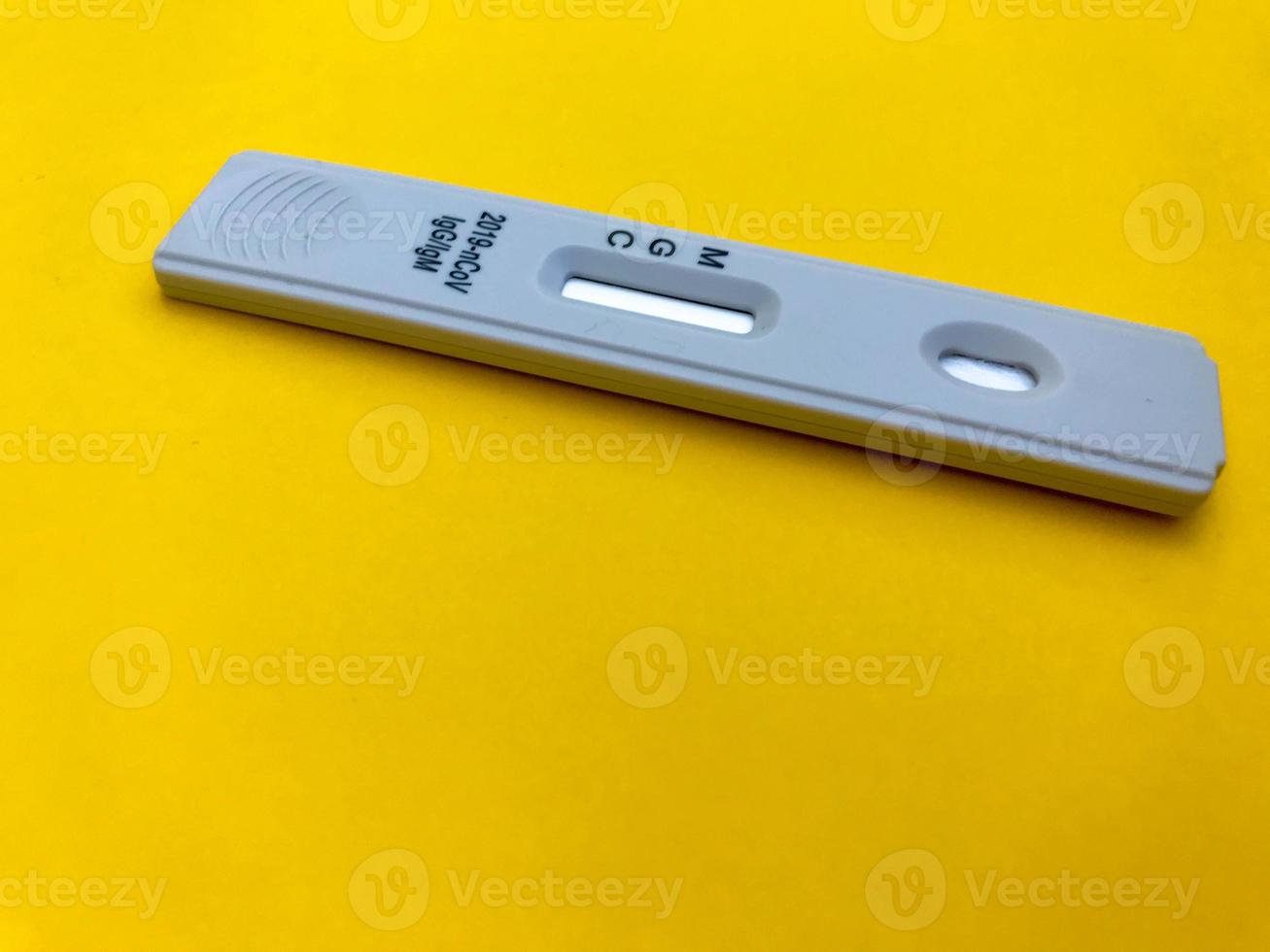 medical procedures. coronavirus test on a bright yellow background. home kit for self-diagnosis. medical procedures for the determination of IgG and IgM antibodies photo