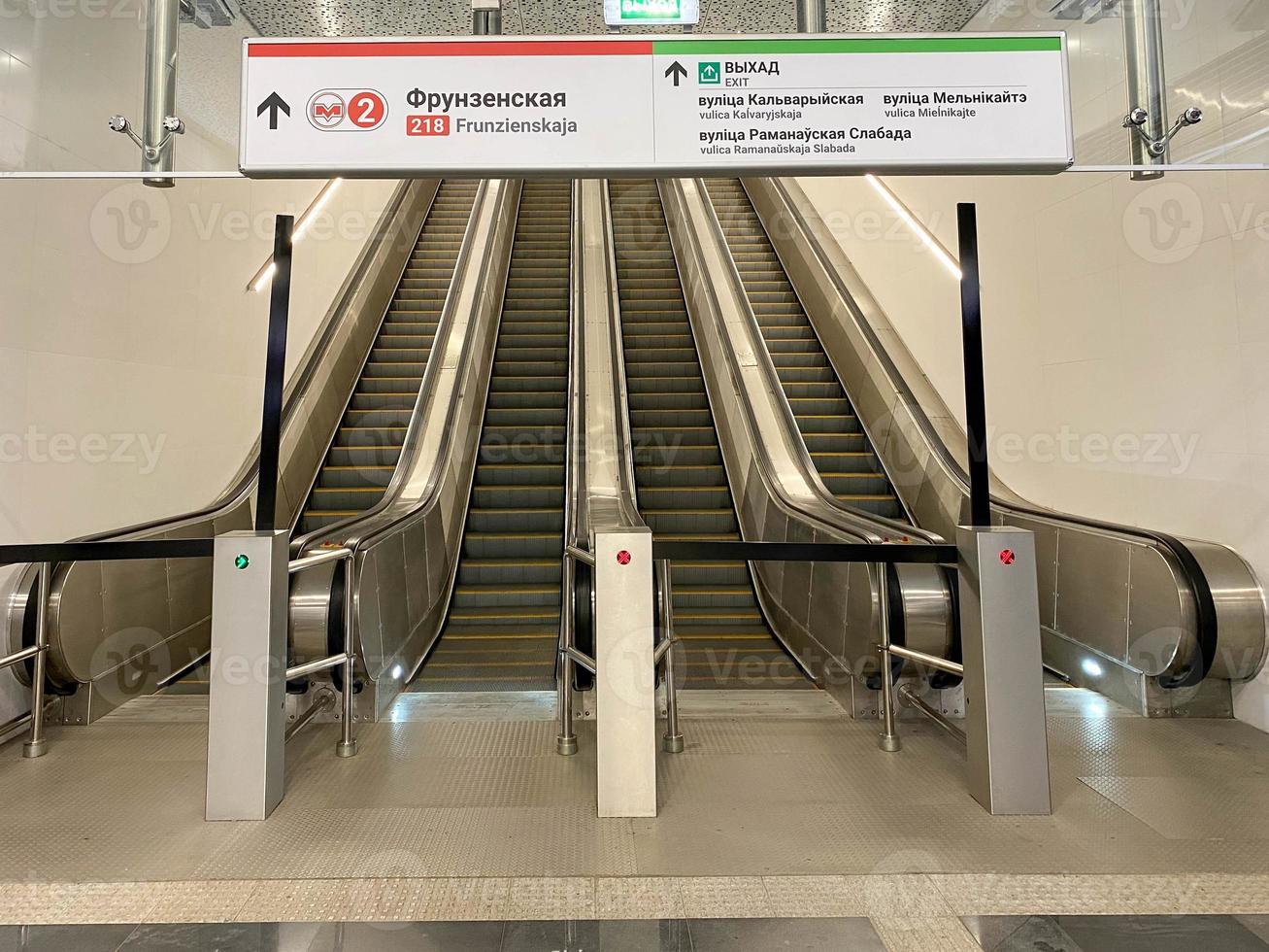 Modern double escalator staircase in shopping mall leading up photo