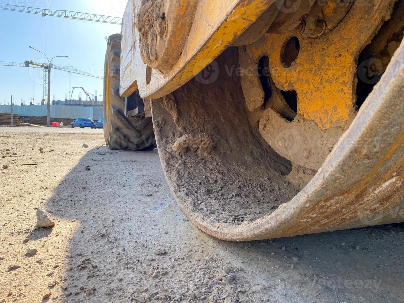 roller compacts asphalt on the road during the construction of the road. compaction of the pavement in road construction. rink photo
