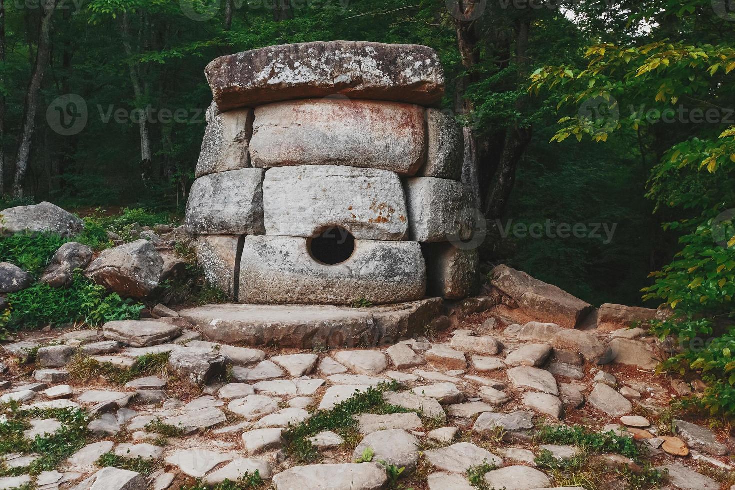 Ancient round compound dolmen in the valley of the river Jean, Monument of archeology megalithic structure. photo