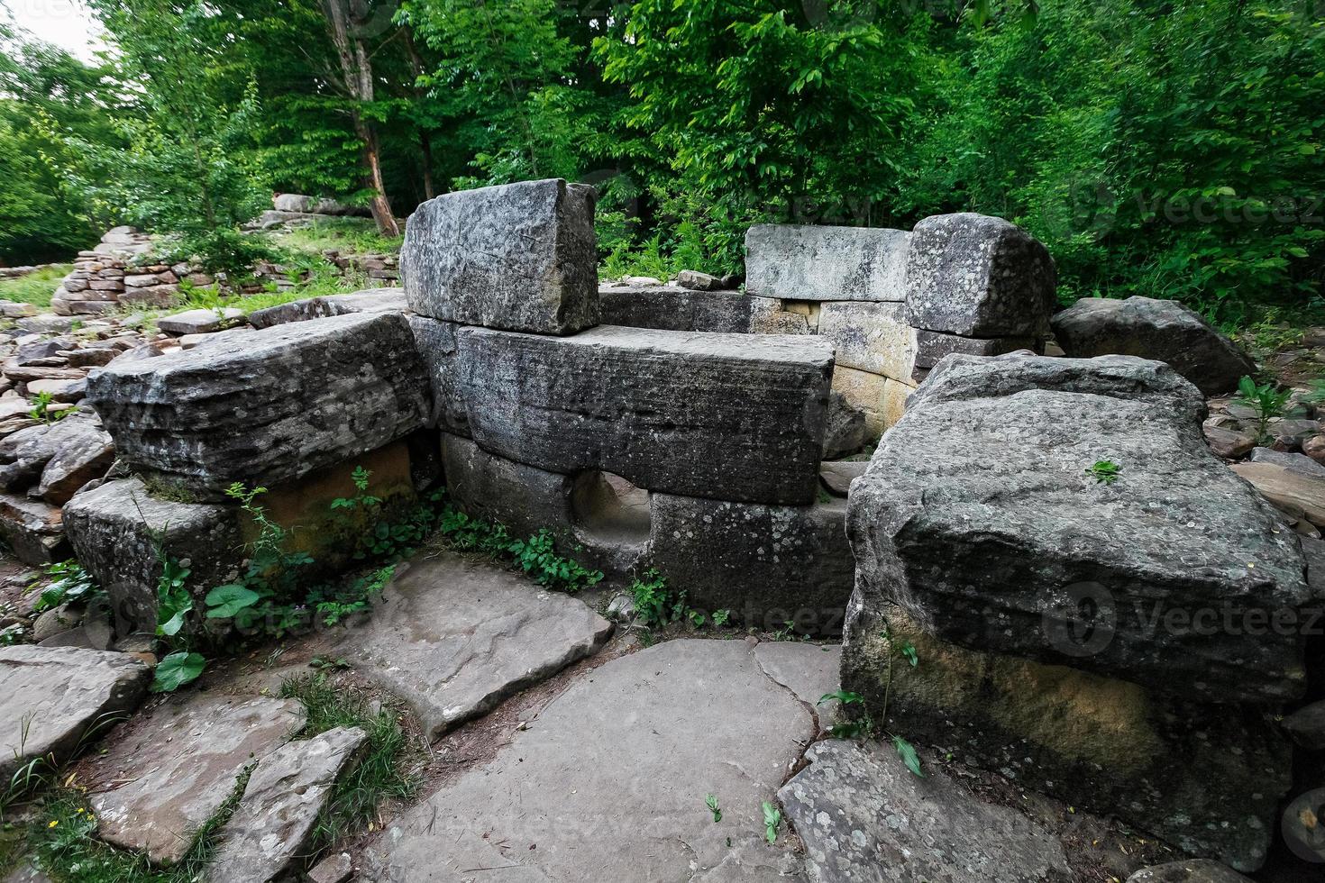 Ancient round ruined dolmen in the valley of the river Jean, Monument of archeology megalithic structure photo