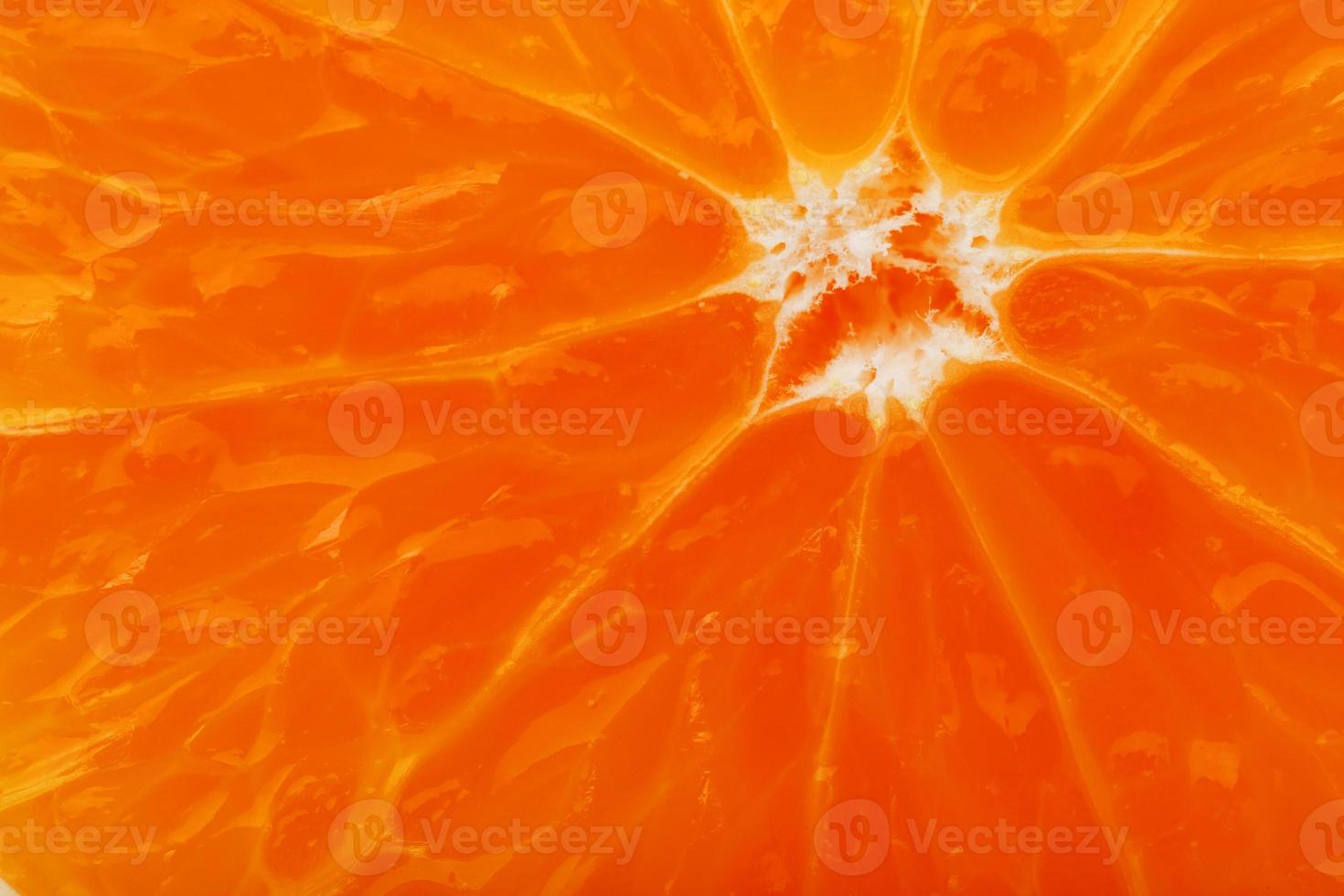 Slices of ripe orange backlit as a textural background. Full screen, close-up, macro photo