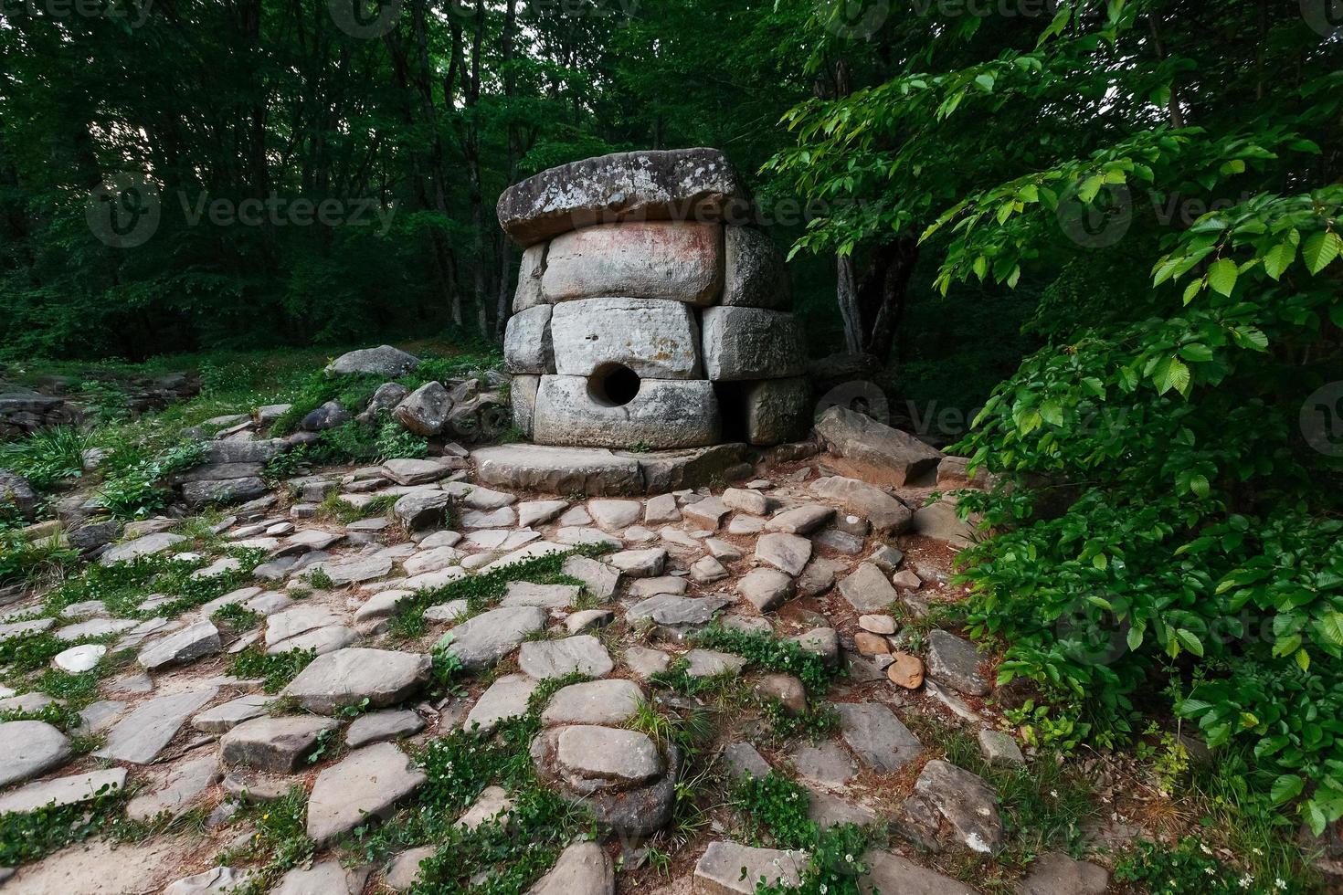 Ancient round compound dolmen in the valley of the river Jean, Monument of archeology megalithic structure. photo