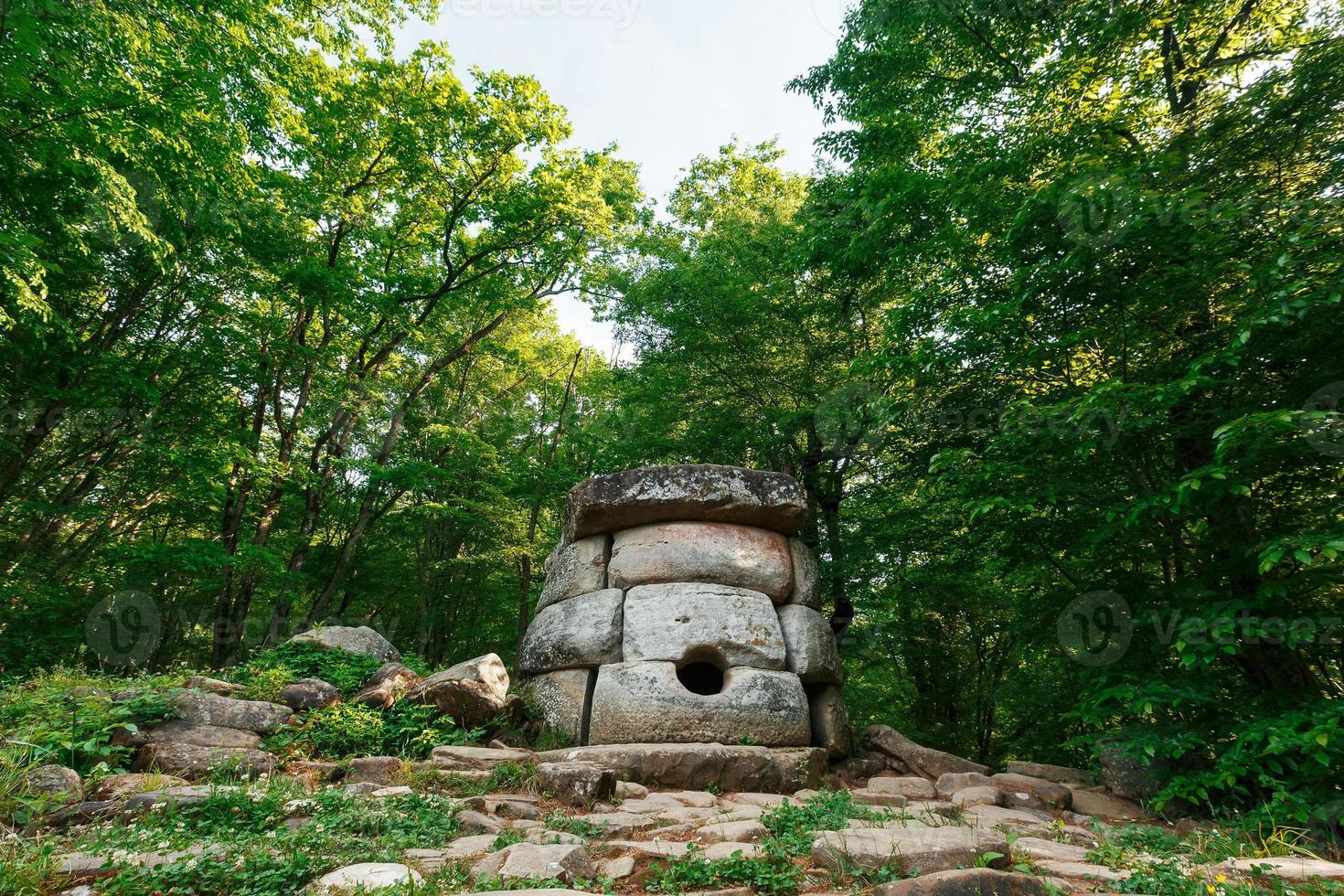 Ancient round compound dolmen in the valley of the river Jean, Monument of archeology megalithic structure. photo