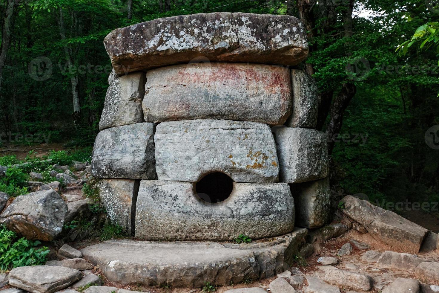 Ancient round compound dolmen in the valley of the river Jean, Monument of archeology megalithic structure. photo