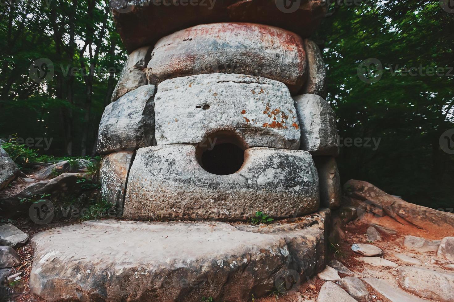 Ancient round compound dolmen in the valley of the river Jean, Monument of archeology megalithic structure. photo