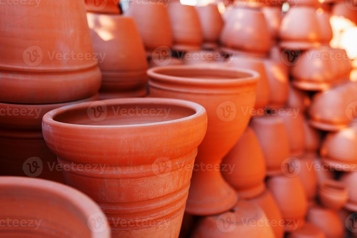 Handmade ceramic crockery made of clay of brown terracotta color photo