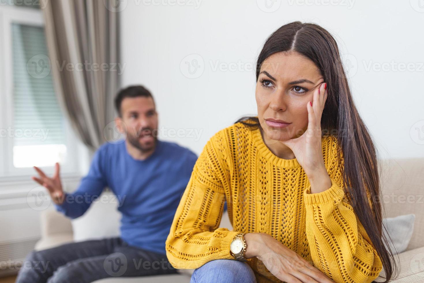 Young couple in conflict, man and woman fight. Furious couple arguing while having problems in their relationship. Young couple arguing while having problems in their relationship. photo