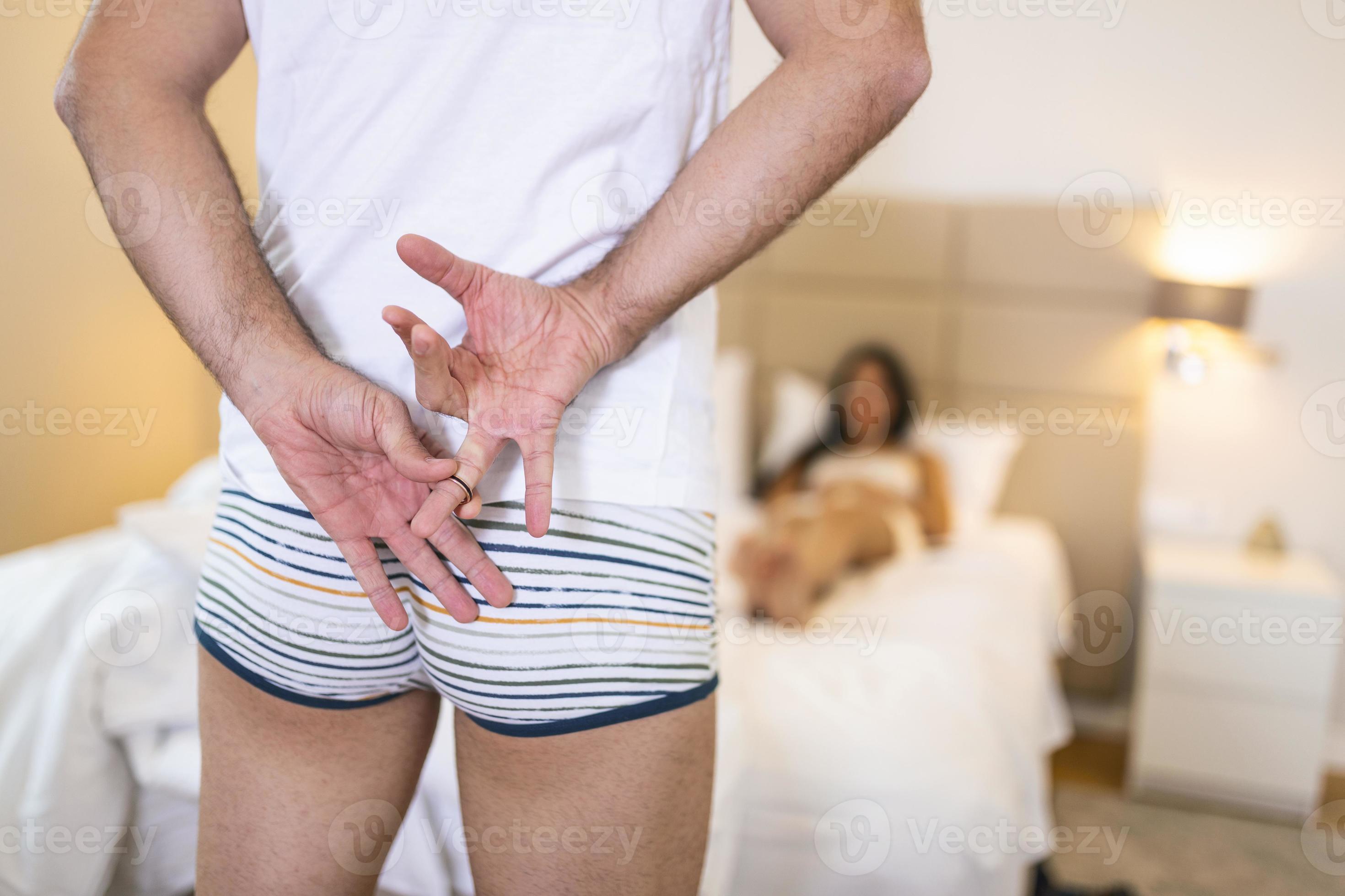 Man Hiding Golden Wedding Ring From His Girlfriend. Cheating in a relationship. concept Infidelity by bad husband photo