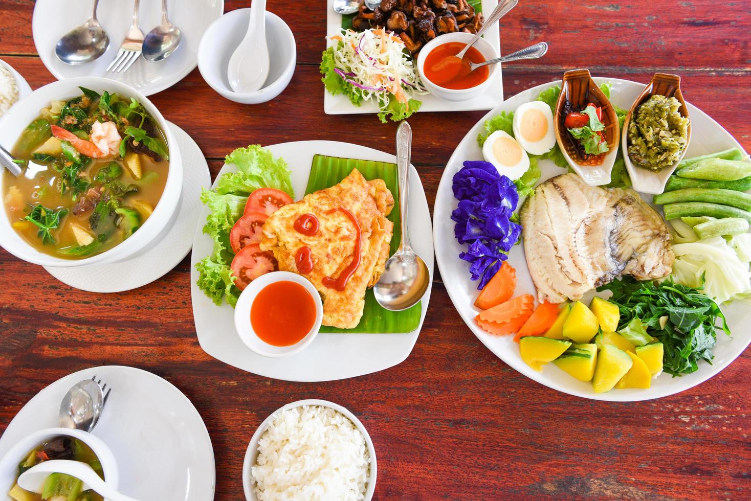 thai food top view asian food served on wooden table setting with plate menu in thailand photo