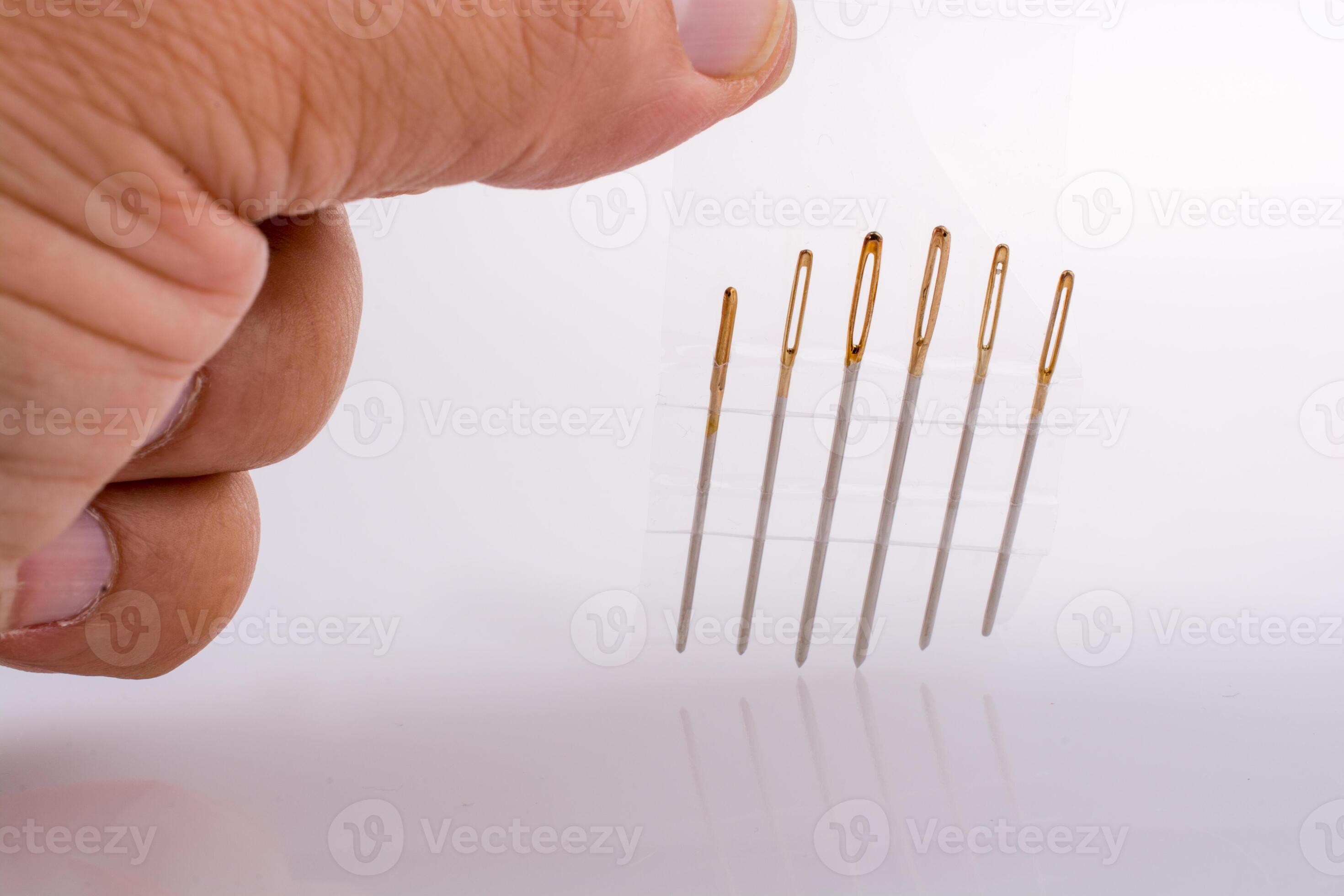 Six different sewing needles isolated on a white background 14446177