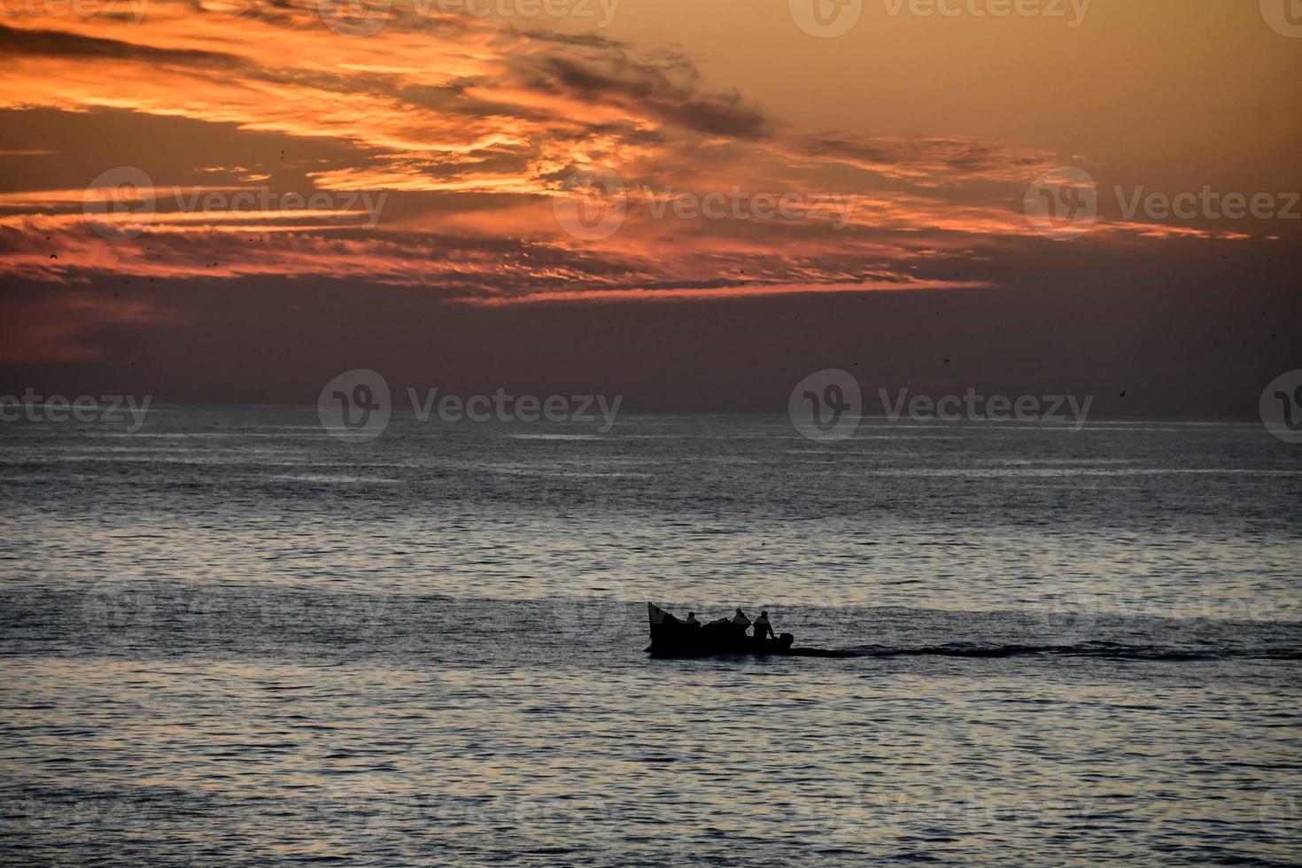 Sunset over the ocean photo