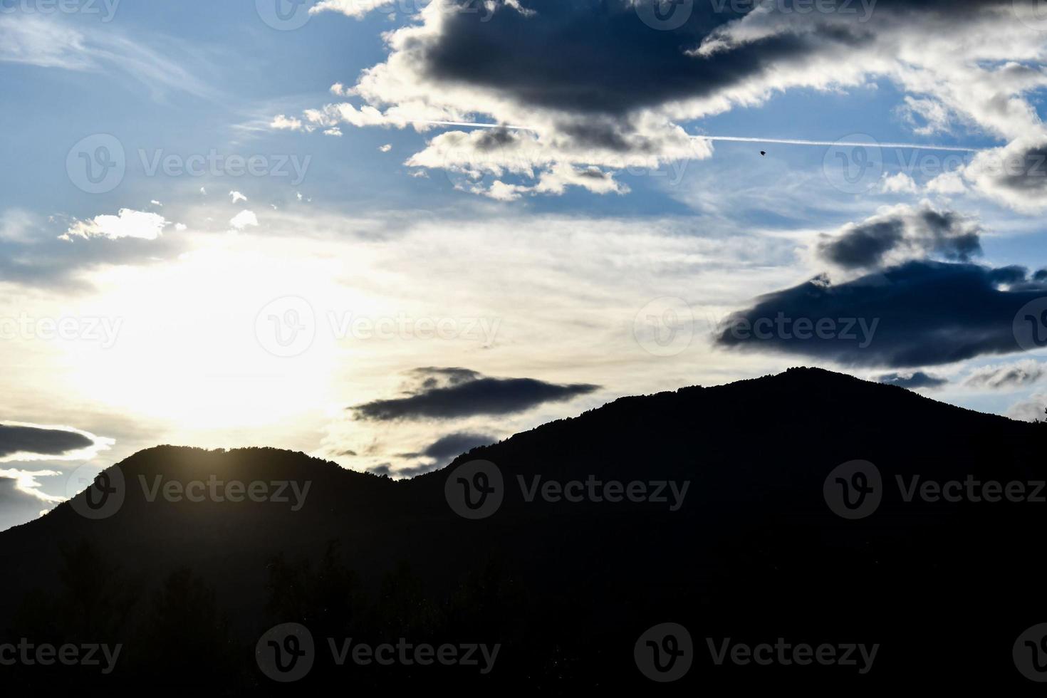 Mountain silhouette at sunset photo